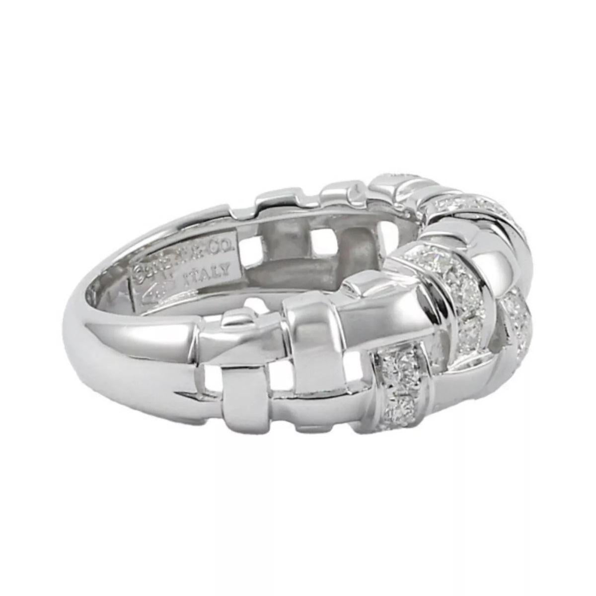 TIFFANY & Co. 18K White Gold Diamond Woven Ring 6

Metal: 18K White Gold
Size: 6
Band Width: 8.5mm at the widest point on the top
Weight: 6.20 grams
Diamond: 20 round brilliant diamonds, carat total weight .36
Hallmark: ©2002 T&CO. 750