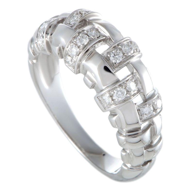 TIFFANY & Co. 18K White Gold Diamond Woven Ring 7.5

Metal: 18K White Gold
Size: 7.5
Band Width: 8.5mm at the widest point on the top
Weight: 6.90 grams
Diamond: 20 round brilliant diamonds, carat total weight .36
Hallmark: ©2002 T&CO. 750