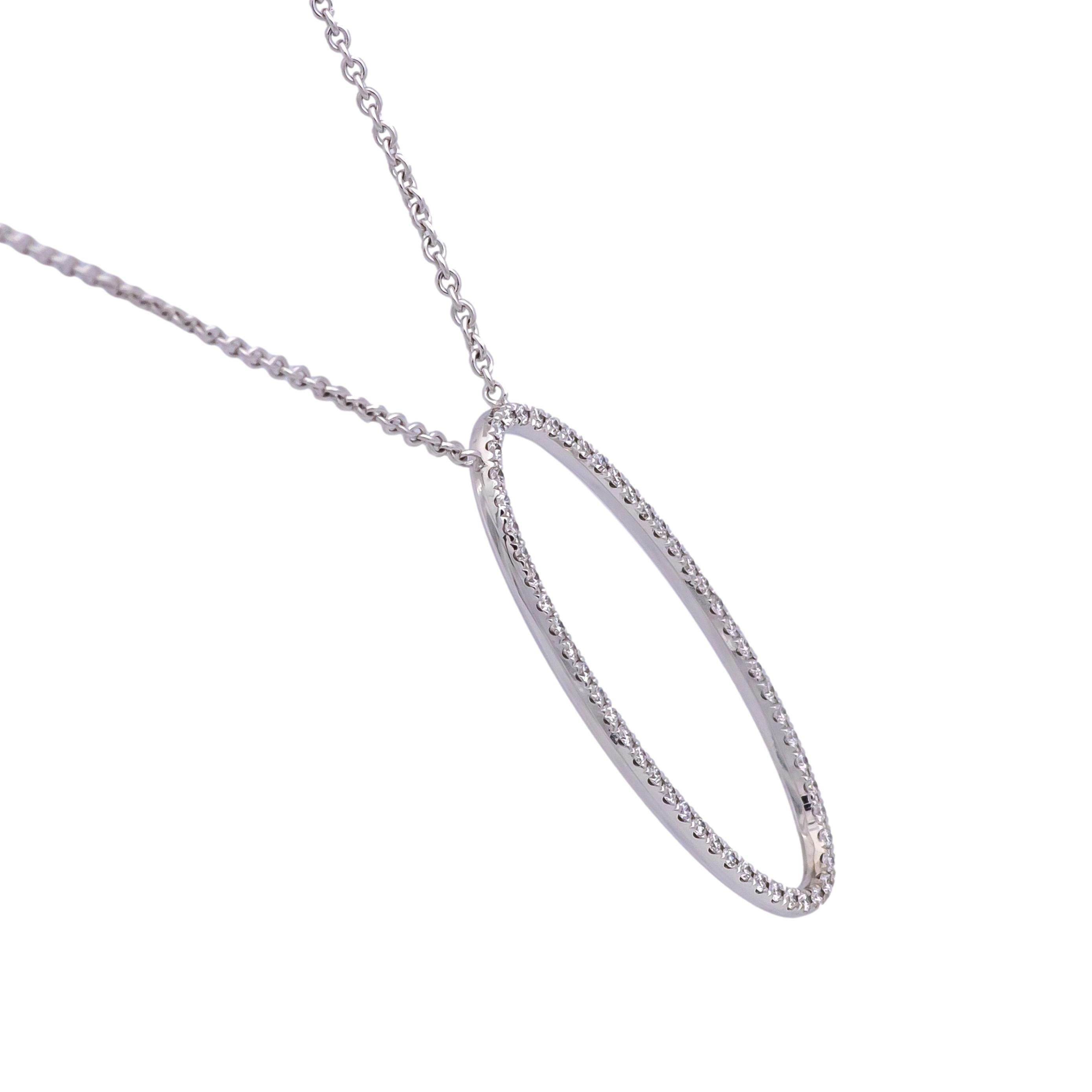 Pre-owned Tiffany & Co. pendant necklace from the Metro collection finely crafted in 18 karat white gold featuring an open oval shape center with 55 pave set round brilliant cut diamonds weighing 0.28 carats total weight approximately hanging off a