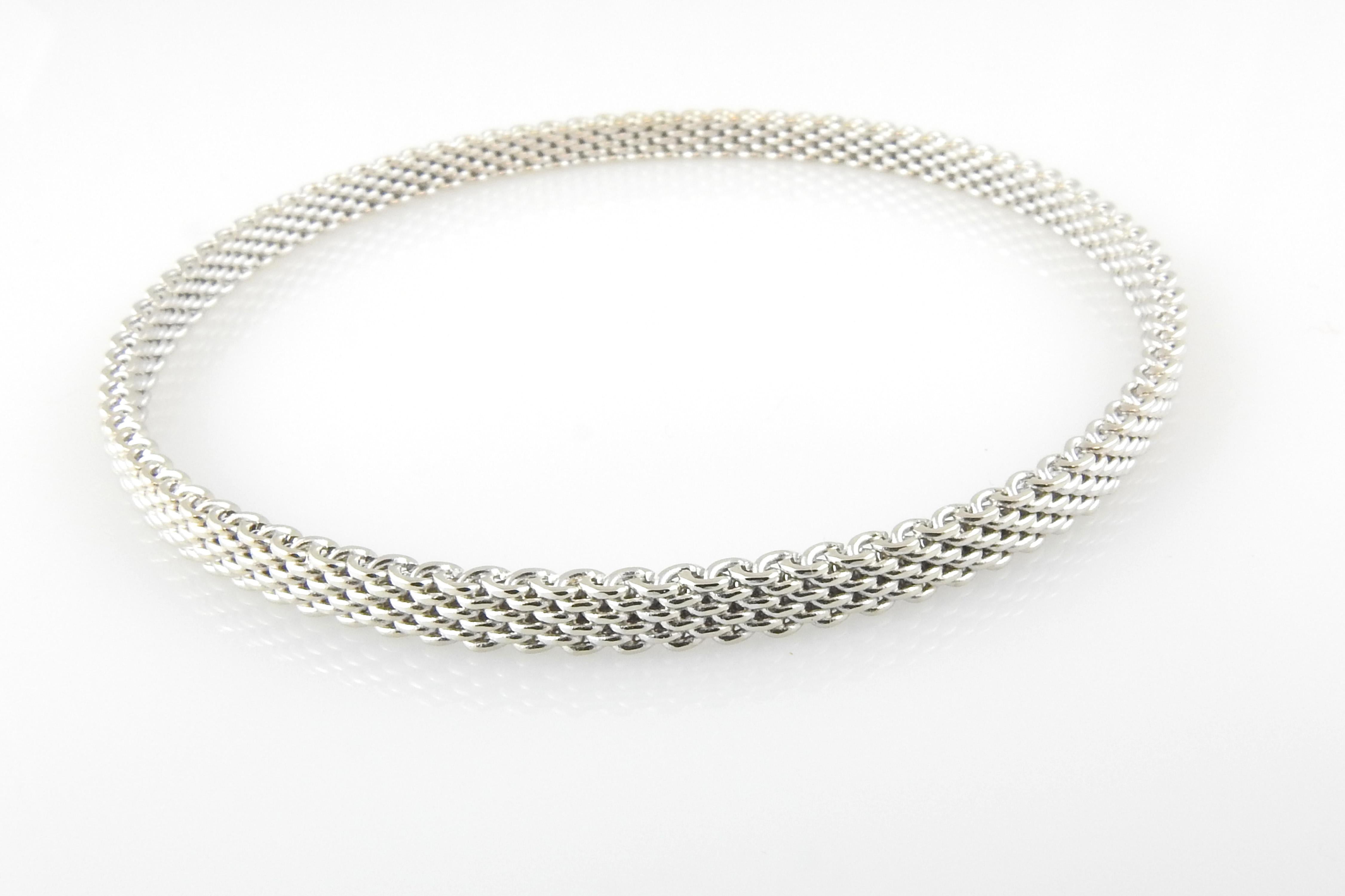 Tiffany & Co. 18K White Gold Somerset Mesh Bracelet

This beautiful Tiffany & Co. mesh bangle bracelet is set in 18K white gold.

**Matching bracelets available in our store in rose and yellow gold**

Bracelet is approx. 4mm wide, and 8