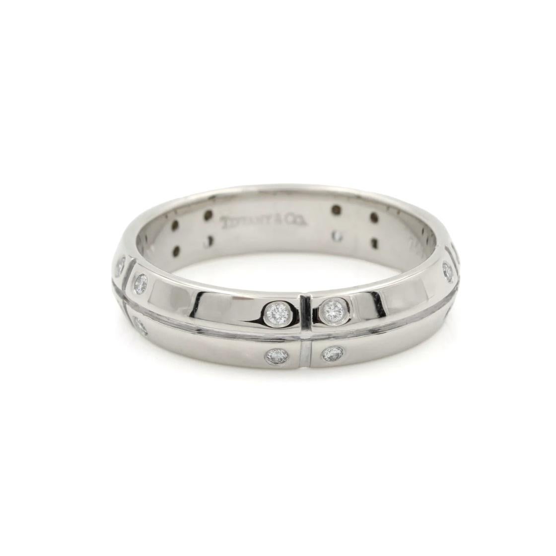 TIFFANY & Co. 18K White Gold Streamerica Diamond Ring 9.5

Metal: 18K White Gold
Size: 9.5  
Width: 5mm
Weight: 6.80 grams
Diamond: round brilliant diamonds, carat total weight .20 
Hallmark: TIFFANY&Co. 750 ©2000

Limited edition, no longer