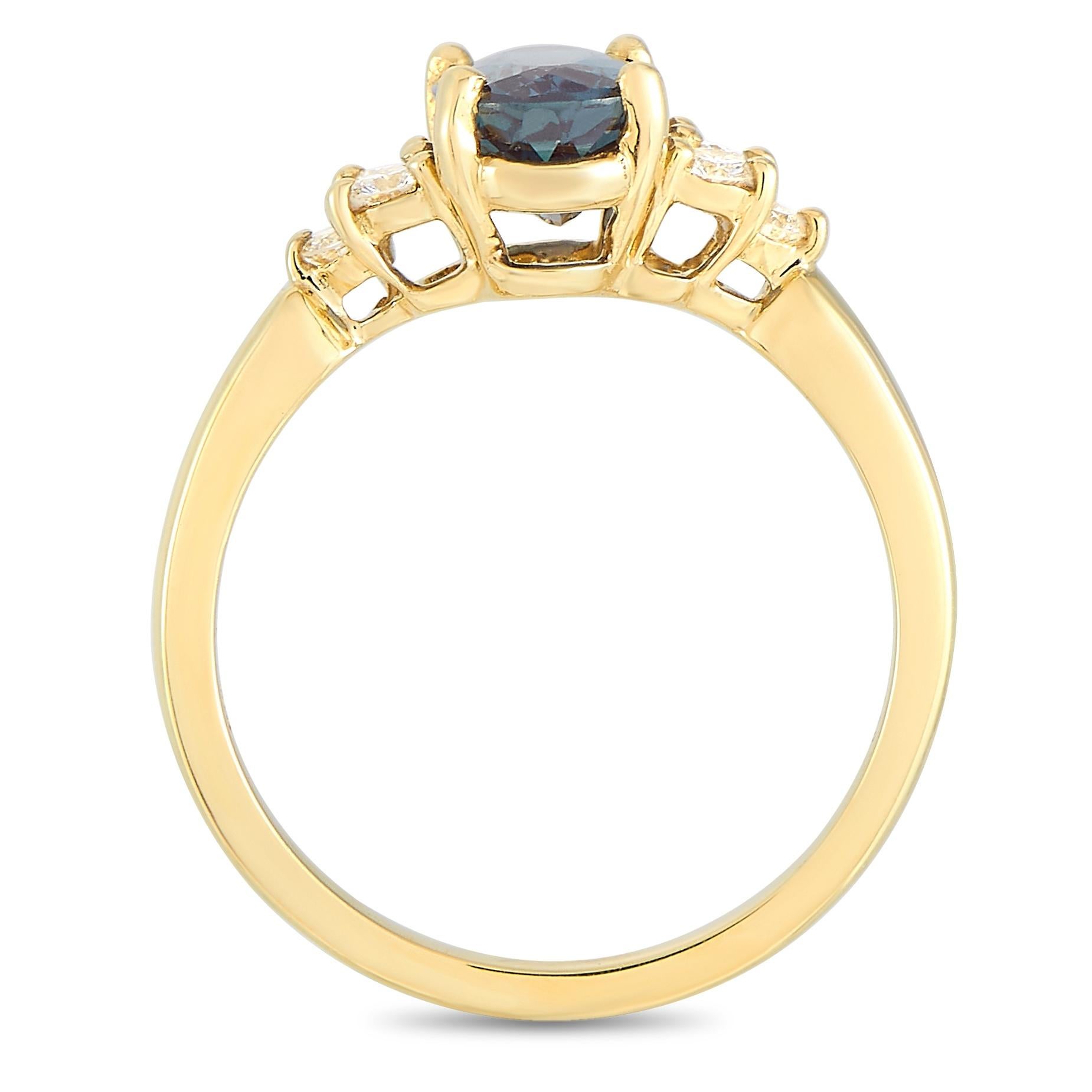 This Tiffany & Co. ring is made of 18K yellow gold and embellished with a 1.59 ct alexandrite and a total of 0.21 carats of diamonds. The ring weighs 3.2 grams. It boasts band thickness of 2 mm and top height of 5 mm, while top dimensions measure 9