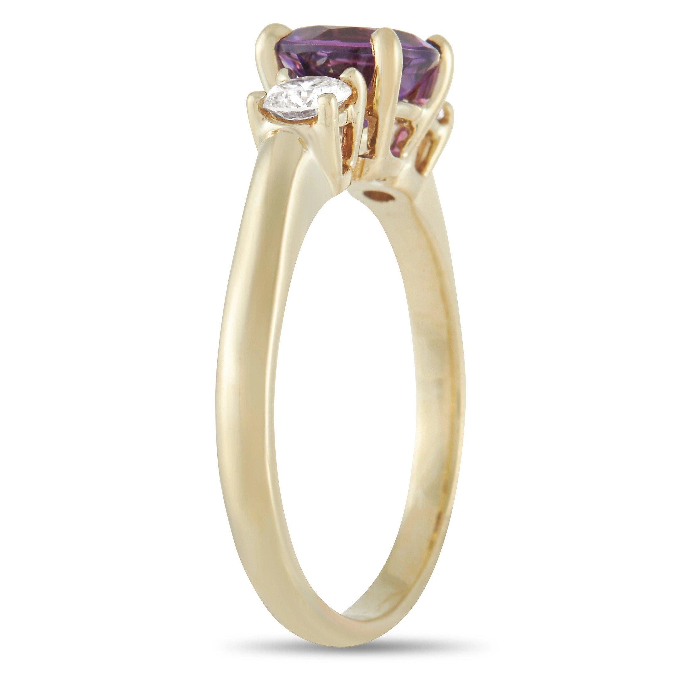 Chic and colorful, this ring from Tiffany & Co. is the perfect addition to any collection. Made from opulent 18K Yellow Gold it features a dainty 2mm band and a 5mm top height. At the center, you’ll find a deep purple amethyst gemstone surrounded by