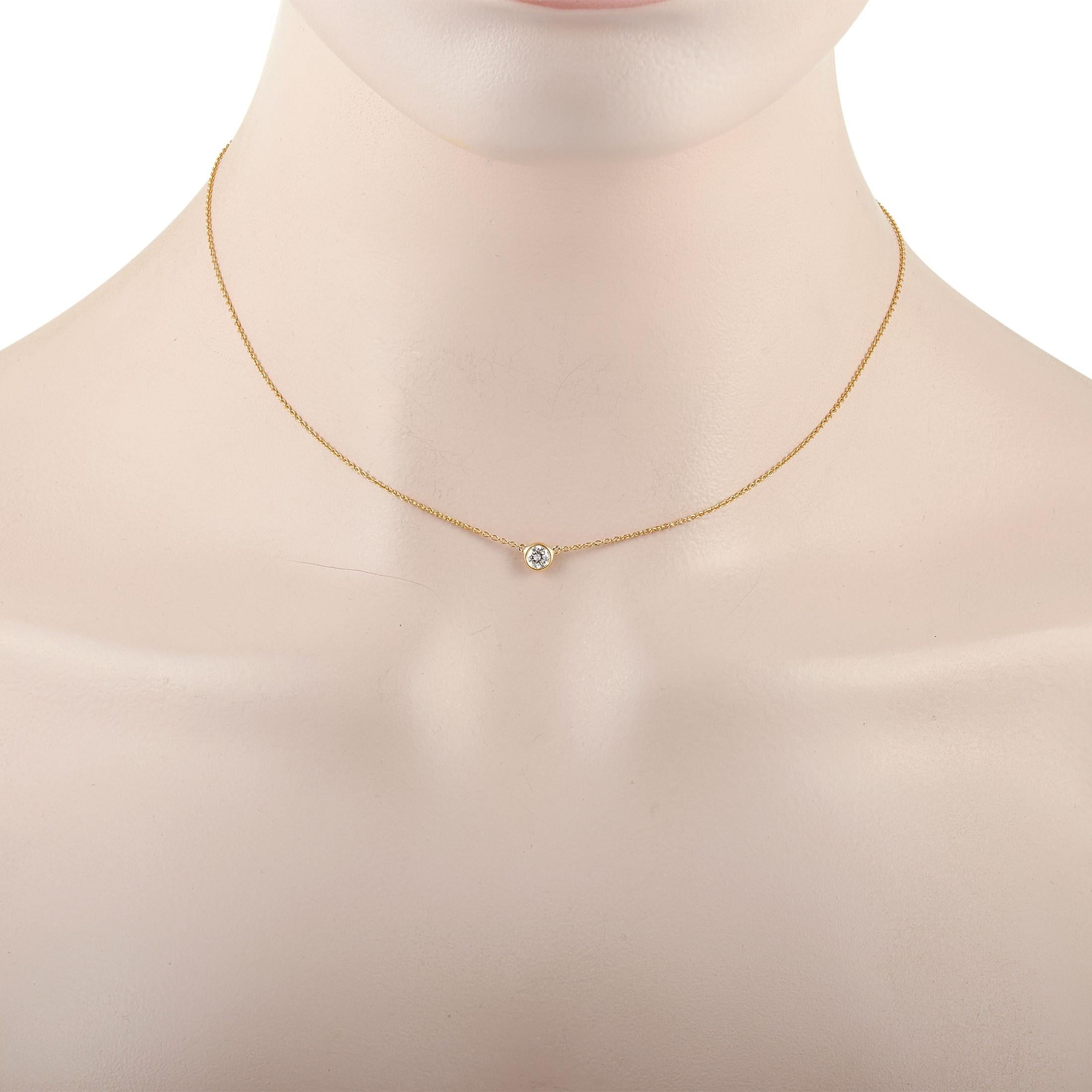 This classic Tiffany & Co. 18K Yellow Gold 0.35 ct Diamond necklace is made with 18K yellow gold and features a solitary 0.35 carat bezel-set diamond pendant. The delicate 18K Yellow Gold Chain measures 15 inches in length and features a spring-ring