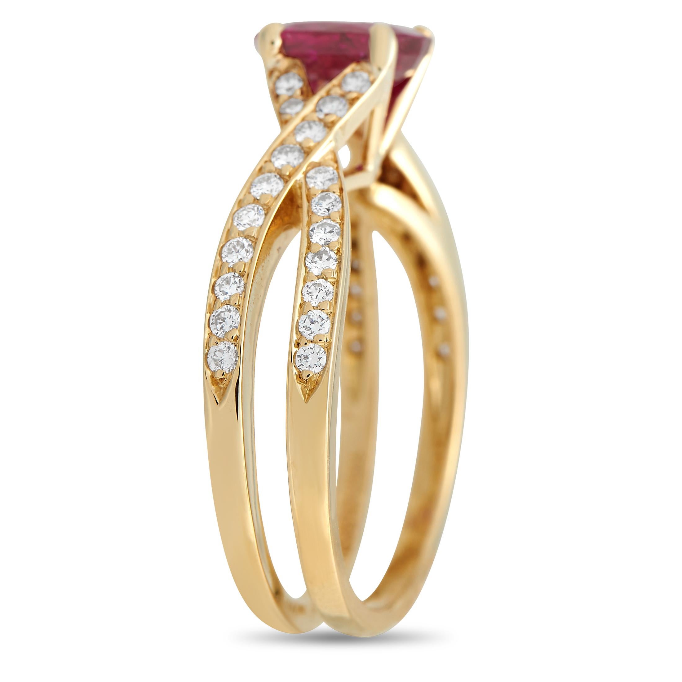 A ring that epitomizes grace and class. This Tiffany & Co. ring in 18K yellow gold features two slender bands that cross and come together to elegantly carry a stunning 1.32 ct ruby center stone. The colored central gem is mounted on a V-prong