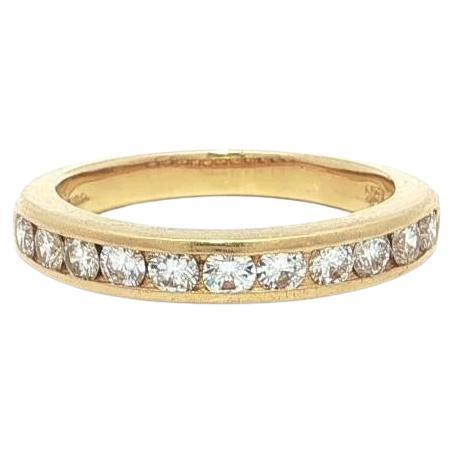 Anillo Tiffany & Co. de oro amarillo de 18 quilates con diamantes redondos engastados en canal de 0,35 cts.