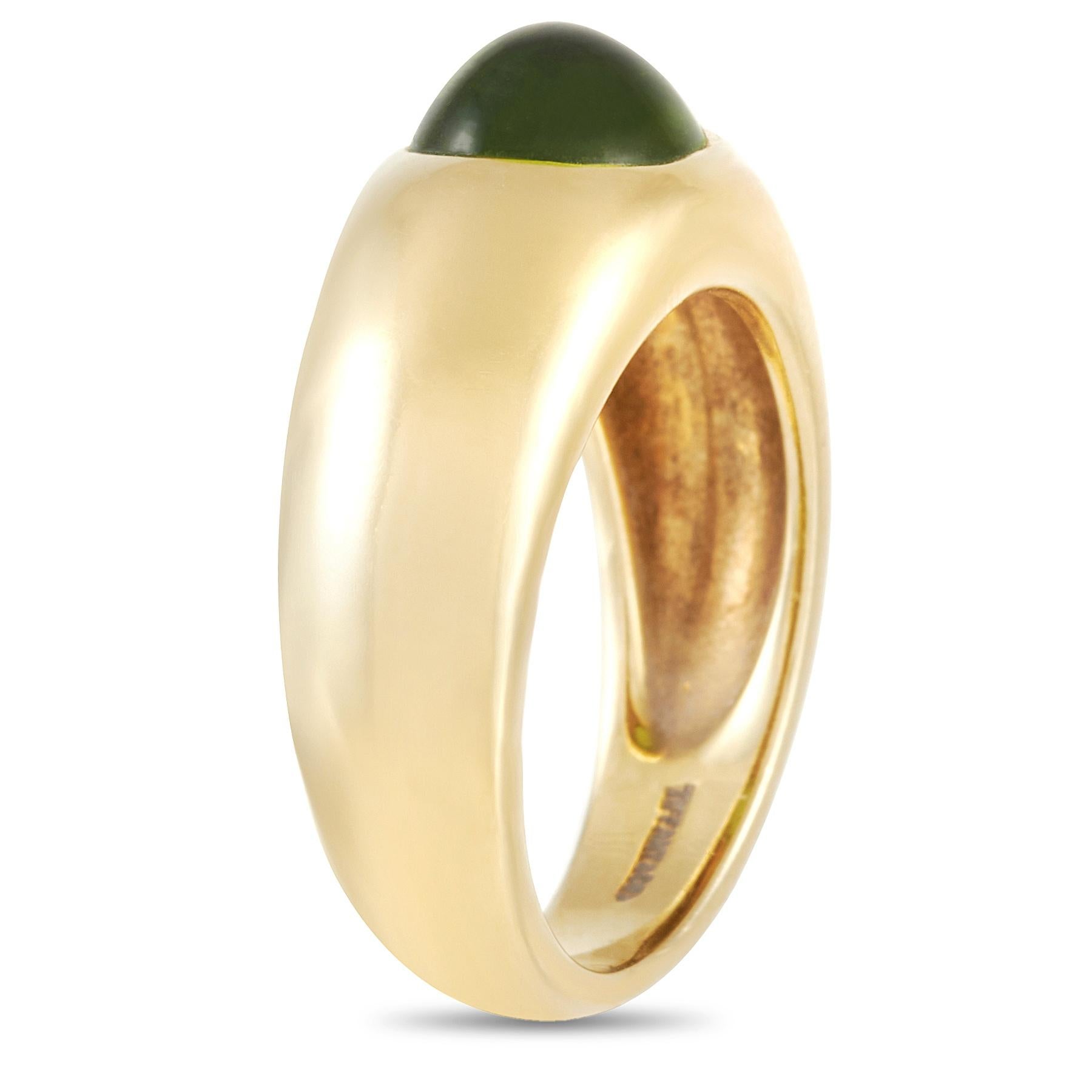 This Tiffany & Co. 18K Yellow Gold 0.37 ct Peridot Ring is a lovely piece. The band is made with 18K yellow and set with a single large peridot. The ring has a band thickness of 7 mm, a top height of 6 mm, and top dimensions of 8 by 9 mm, with a