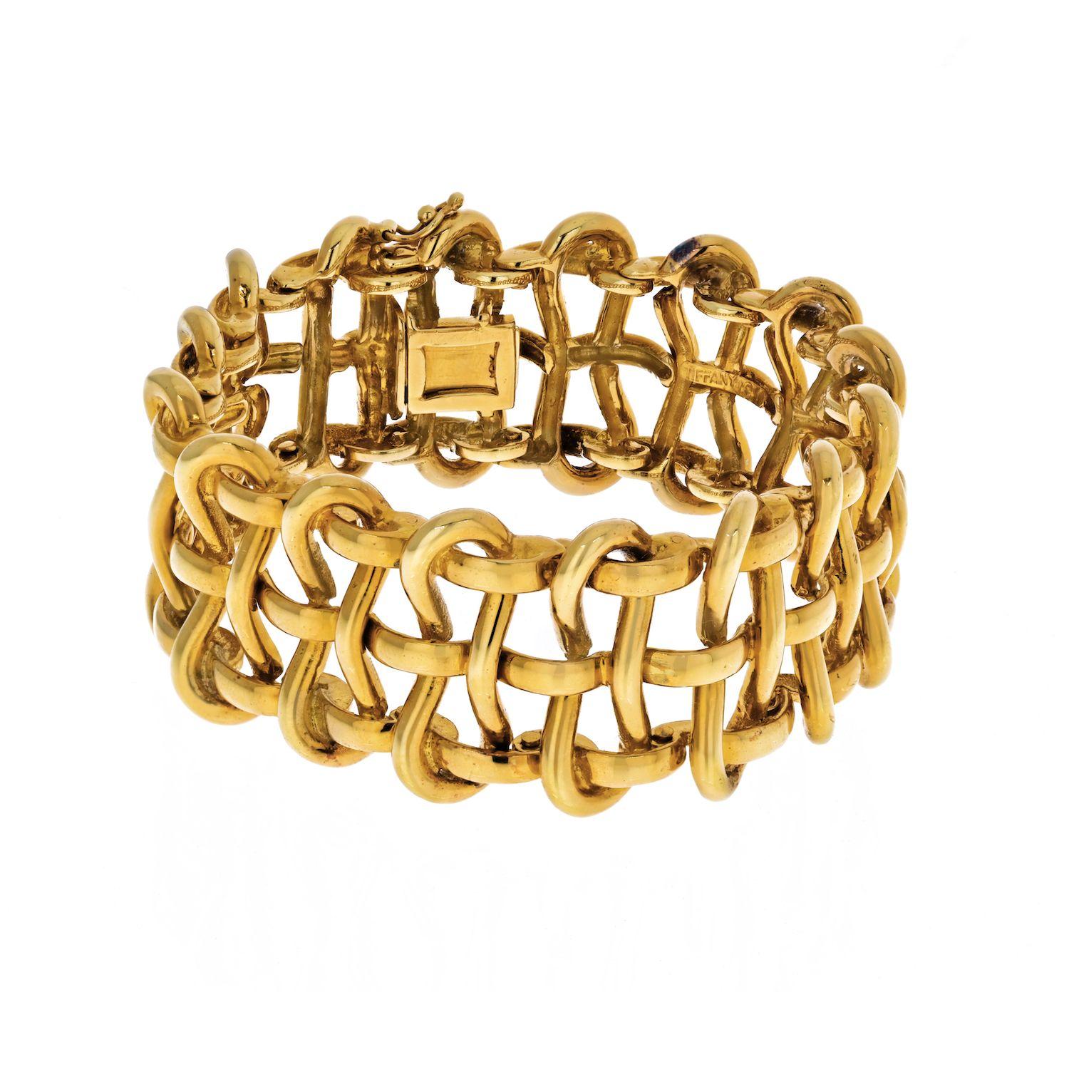 This striking piece by Tiffany & Co this yellow gold open wire bracelet is both timeless and bold. You can#t find a more classic piece of jewelry than a vintage gold bracelet from Tiffany & Co. This Mid-Century Tiffany & Co offering has a