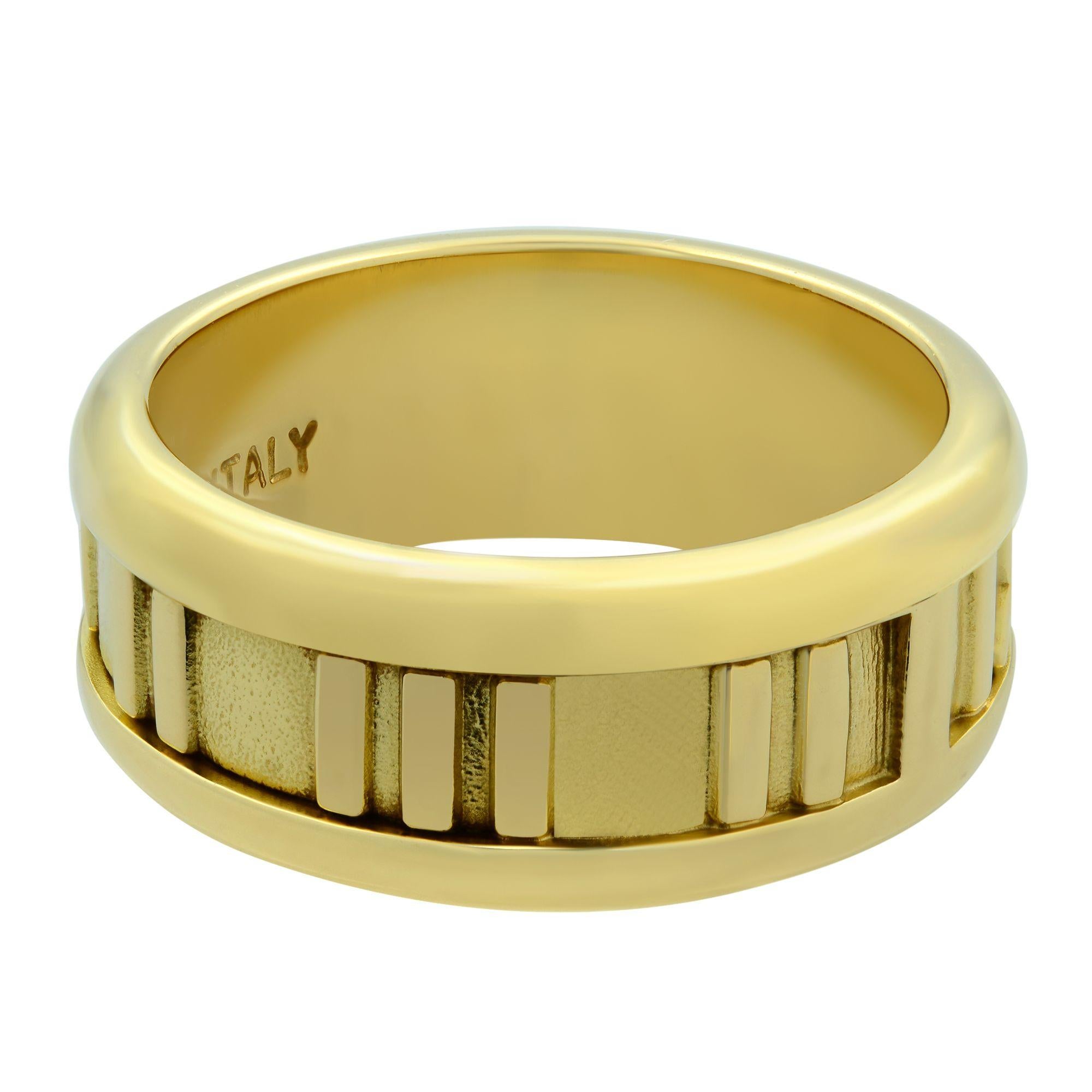 Tiffany & Co. from the Atlas collection. This ring is crafted from solid 18k yellow gold with a solid platform of fine gold Roman letters in polished finish against a sandgrain surface. It is fully signed Tiffany & Co. with the country's name and