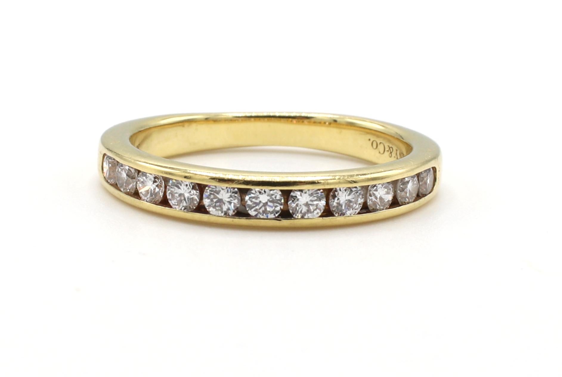 Tiffany & Co. 18 Karat Yellow Gold .33 Carat Channel Set Diamond Wedding Band Ring 
Metal: 18k yellow gold
Weight: 3.1 grams
Diamonds: .33 CTW D-G IF-VS2
Size: 5.5 (US) 
Width: 3mm
Signed: Tiffany & Co. AU750