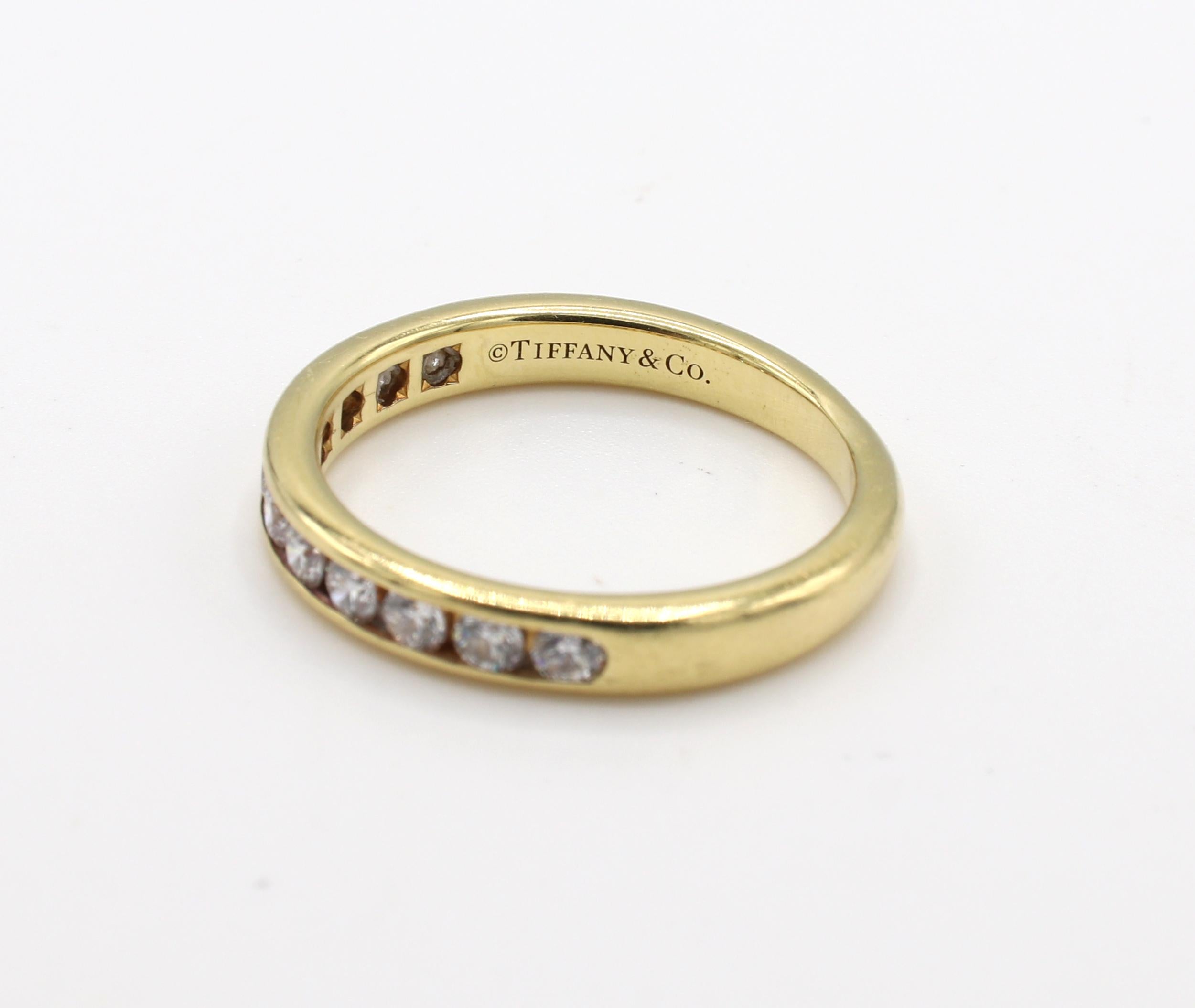 yellow gold channel set diamond band