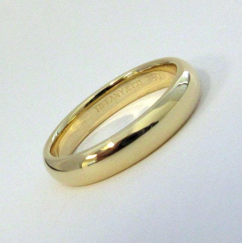 TIFFANY & Co. 18K Yellow Gold 4.5mm Comfort Fit Wedding Band Ring 10

 Metal: 18K yellow gold 
 Size: 10 
 Band Width: 4.5mm
 Weight: 7.80 grams
 Hallmark: TIFFANY&CO. 750
 Condition: Excellent condition, like new

Limited edition, no longer