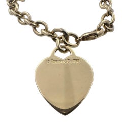 Tiffany & Co. 18K Yellow Gold 6.75" Heart Tag Charm Bracelet.