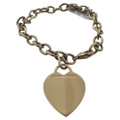 Tiffany & Co. 18K Yellow Gold 6.75" Heart Tag Charm Bracelet.