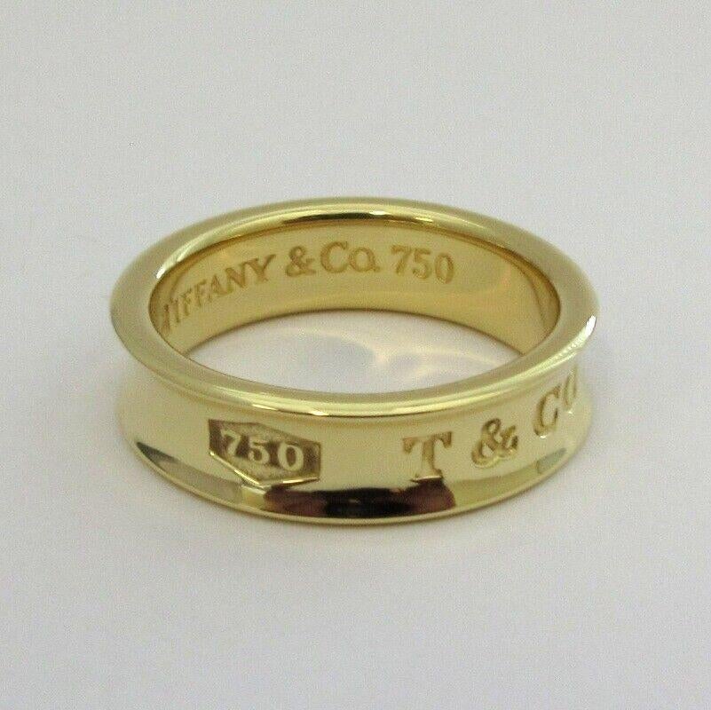 1997 Tiffany & Co 18k Yellow Gold 1837 Ring Band 
18K Yellow gold
Ring size 8.25
Ring width 6mm
Length 21.7mm
Weight 8.2gr
This ring can not be resized 
Ring is in excellent condition 
Comes with Tiffany & co pouch