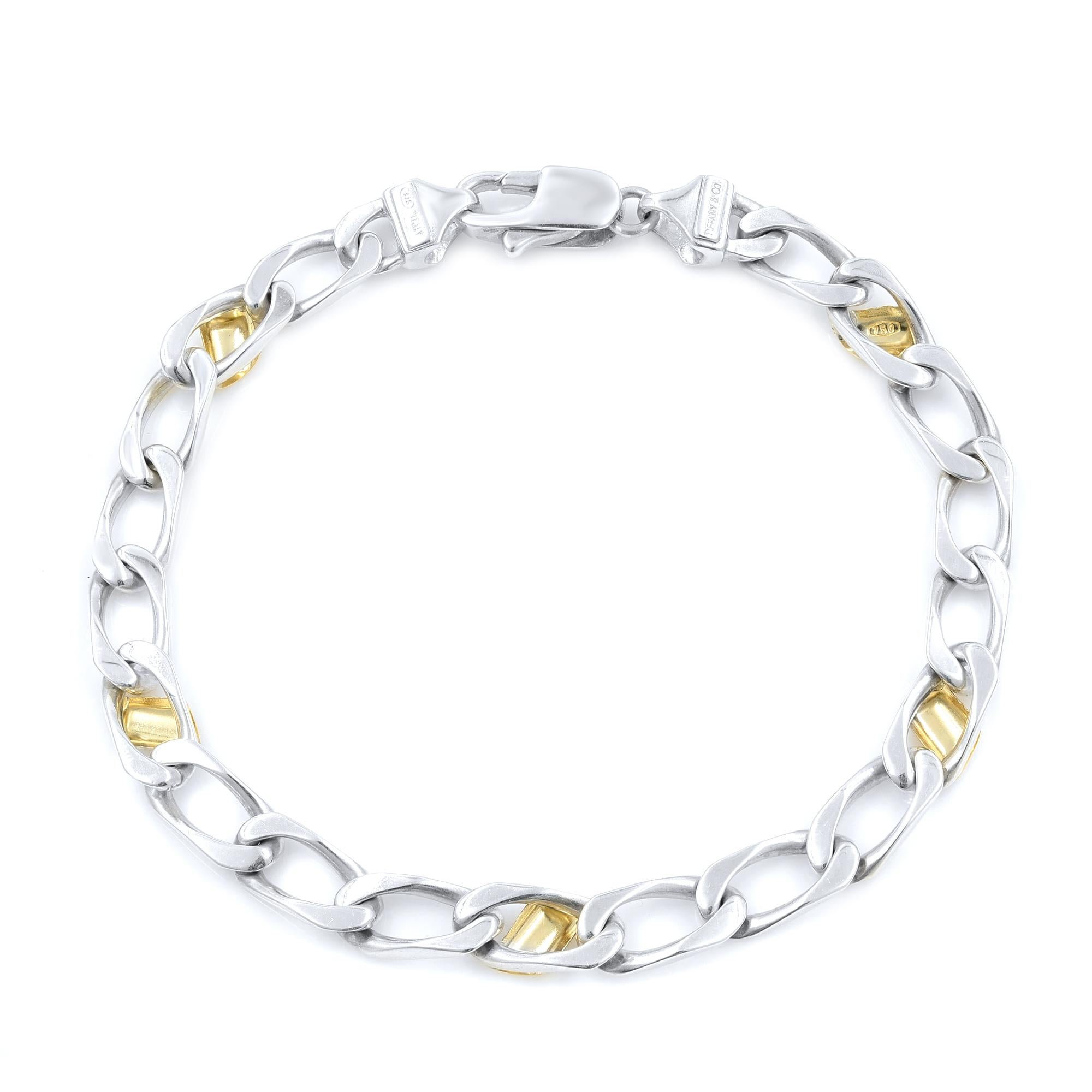 A pre-owned like new Tiffany & Co. 18K Yellow Gold & 925 Sterling Silver Cuban Link Bracelet.
Comes with Tiffany pouch.
Clean. No imperfections. 
Length: 7.5 inch
Width: 5mm
Weight: 11 grams
Made in Italy.