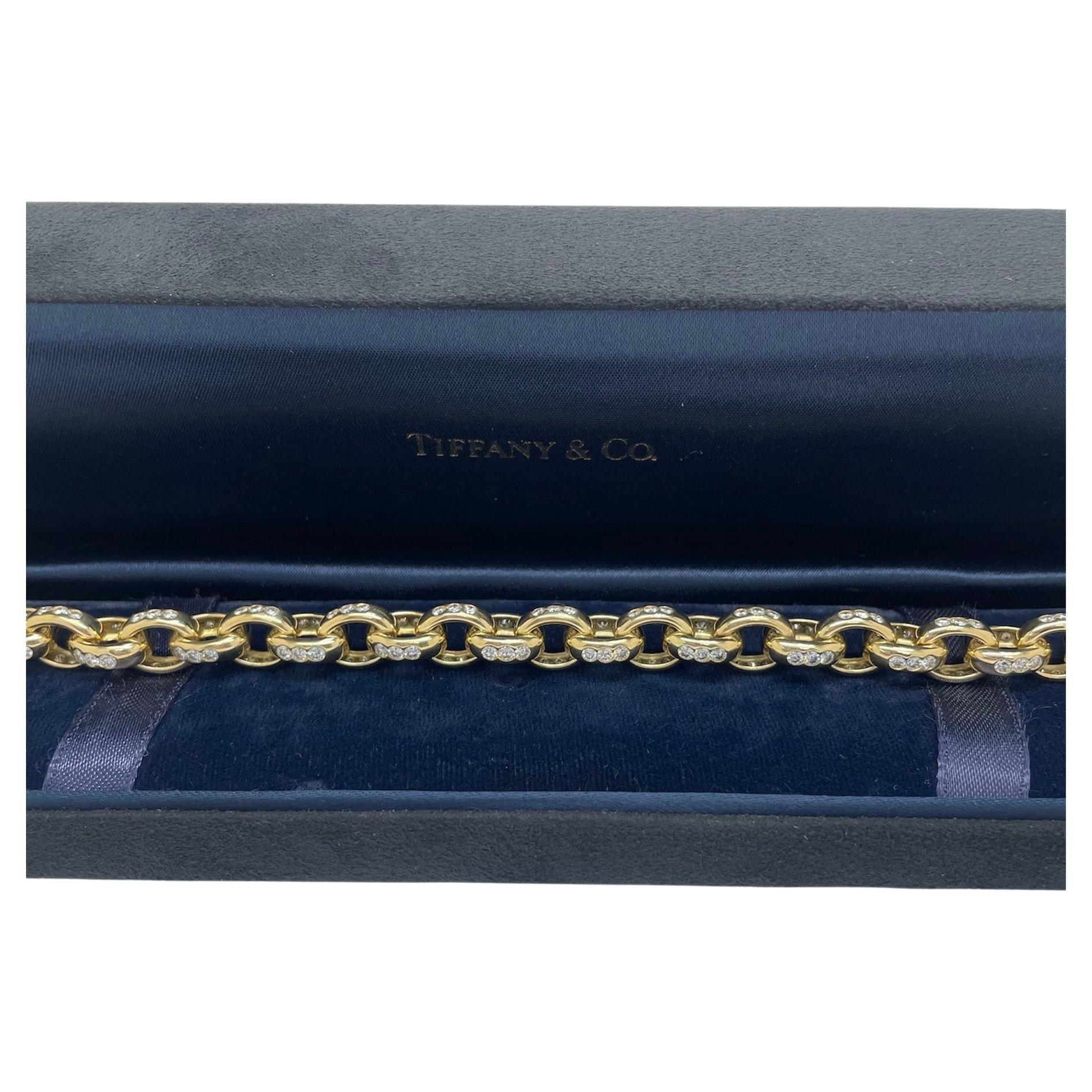 This classic bracelet by Tiffany & Co. is perfect for any outfit! Skillfully crafted cable links decorated with top quality flush bezel set round brilliant cut diamonds with a total weight of 6.00 carats. Very comfortable and extremely wearable