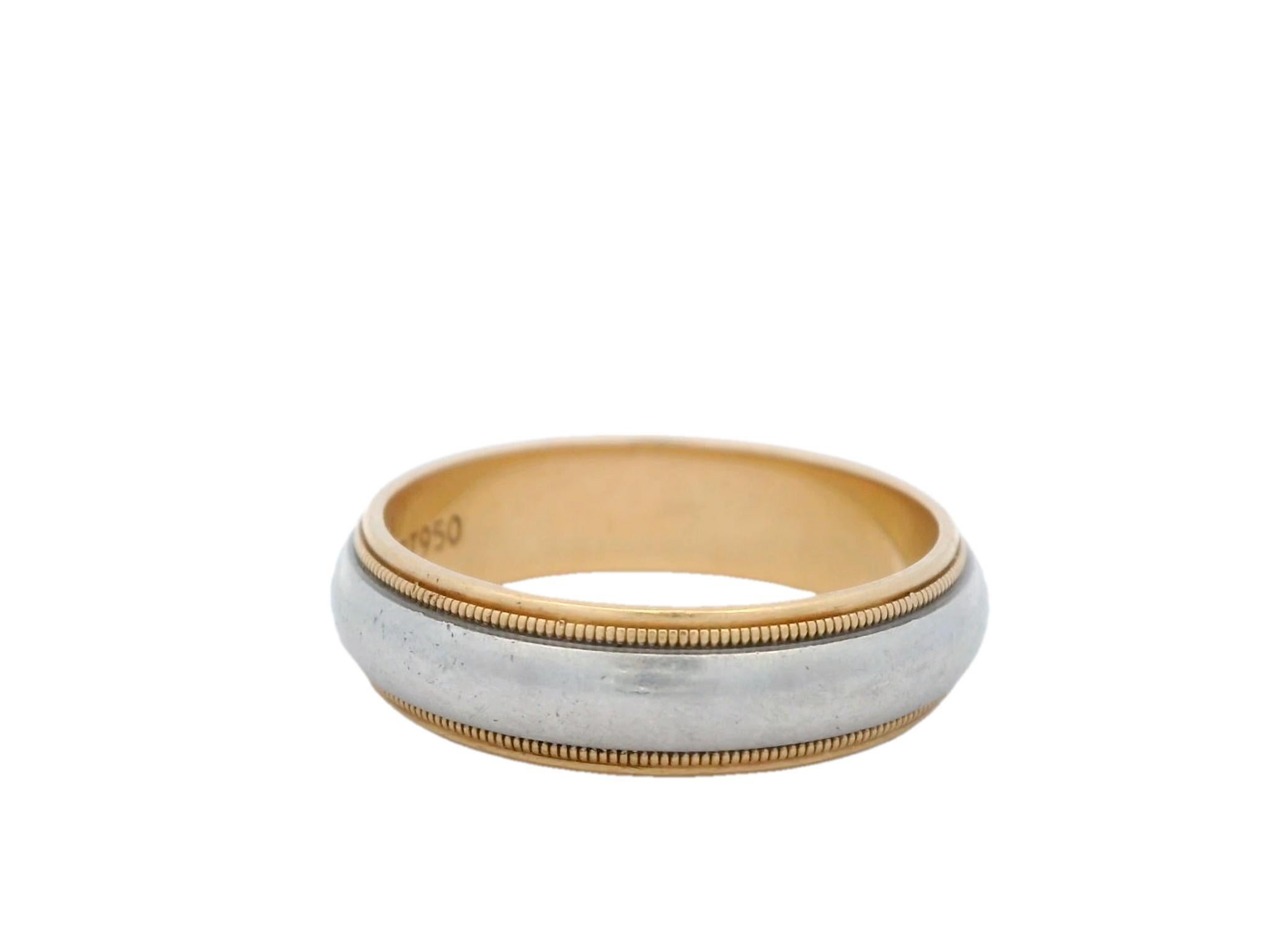 Tiffany & Co. Two Tone Wedding Band in 18K Yellow Gold and Platinum 

The Tiffany & Co. Two Tone Wedding Band in 18K Yellow Gold and Platinum is more than just a piece of jewelry—it's a meaningful symbol of love and craftsmanship. It features a