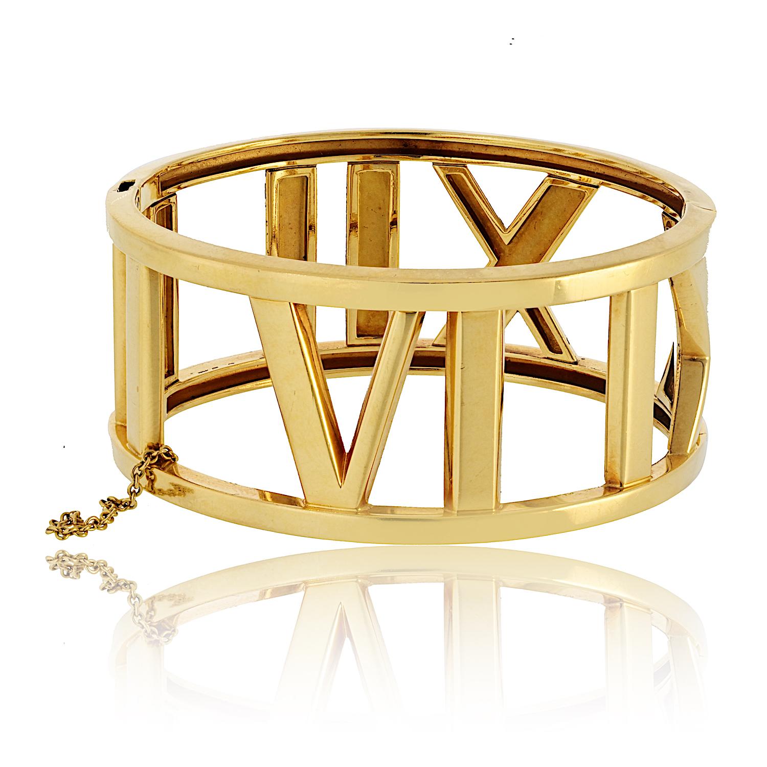 The Tiffany & Co. 18K Yellow Gold Atlas Hinged Bracelet is a stunning statement piece that embodies timeless elegance and bold design. Crafted from luxurious 18K yellow gold, this bracelet features Tiffany's iconic Atlas motif, a tribute to the