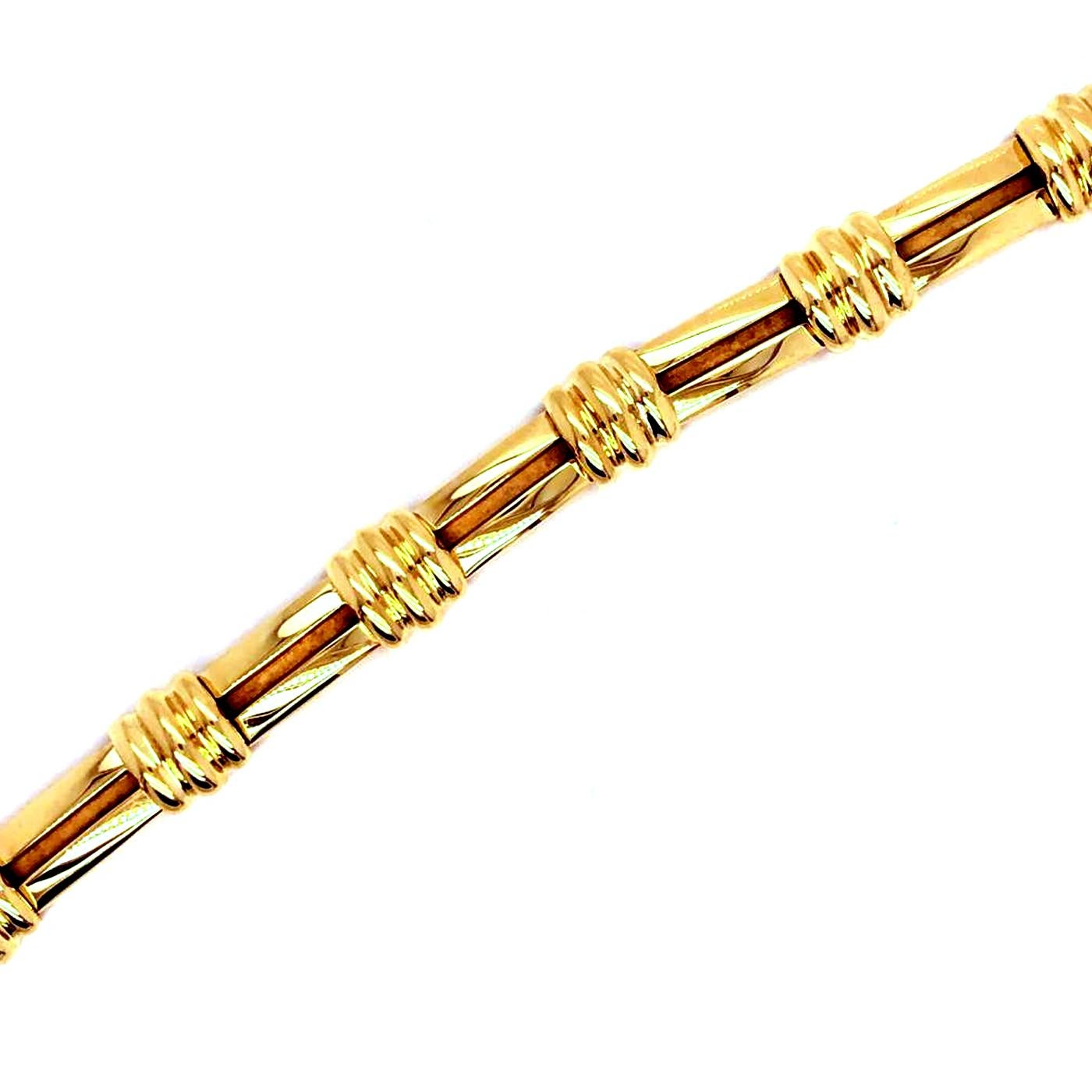 Rare Vintage circa 1995 Authentic Tiffany & Co. 18K Yellow Gold Link Bracelet from Atlas collection in excellent condition. Secure push-button double lock clasp in excellent working order. The Bracelet is appx. 7.5 - 11 mm wide and 7