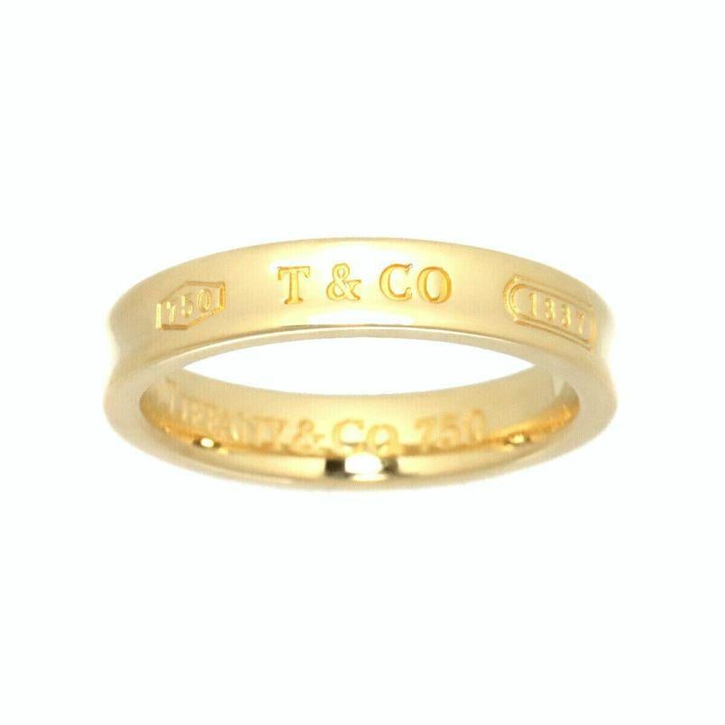 TIFFANY & Co. 1837 18K Yellow Gold 4mm Band Ring 6.5

Metal: 18K yellow gold 
Size: 6.5
Band Width: 4mm
Weight: 6.0 grams
Hallmark: 