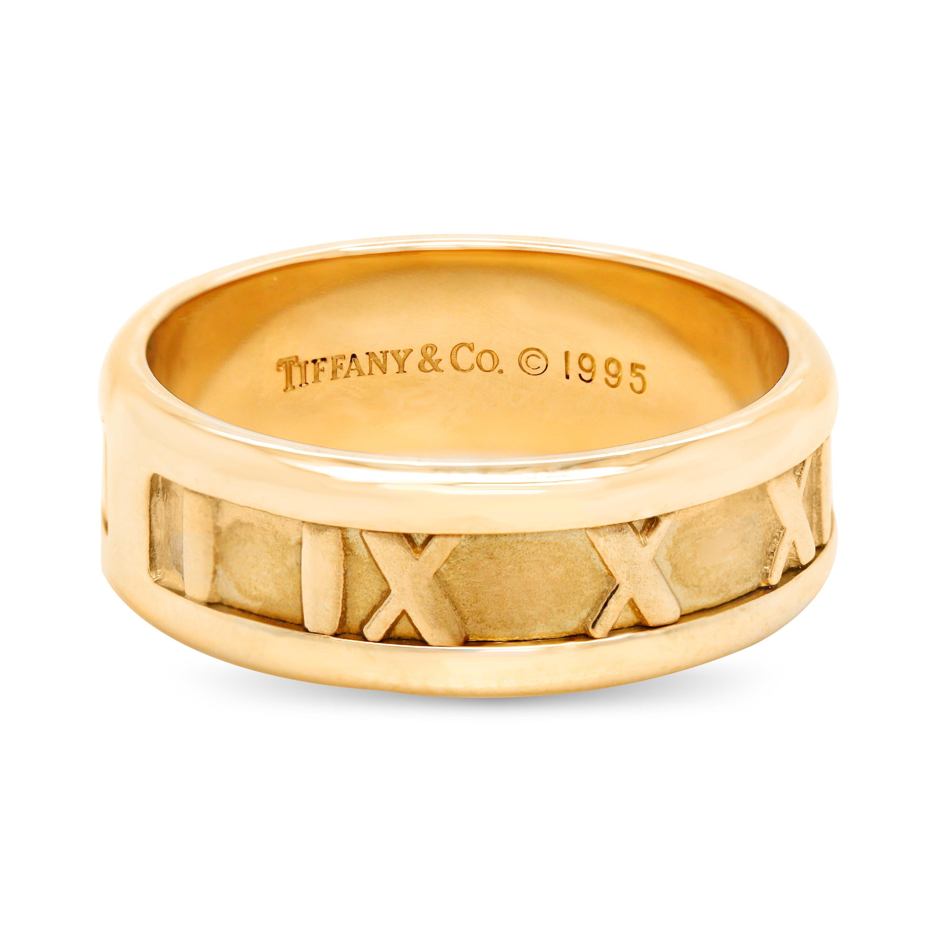 Tiffany & Co 18K Yellow Gold Atlas Roman Numeral Wedding Band Ring

Crafted in 18k Yellow Gold
Ring Size: 7.5

Band width is 7.5mm

Signed Tiffany & Co, 750 Italy

Mint condition.