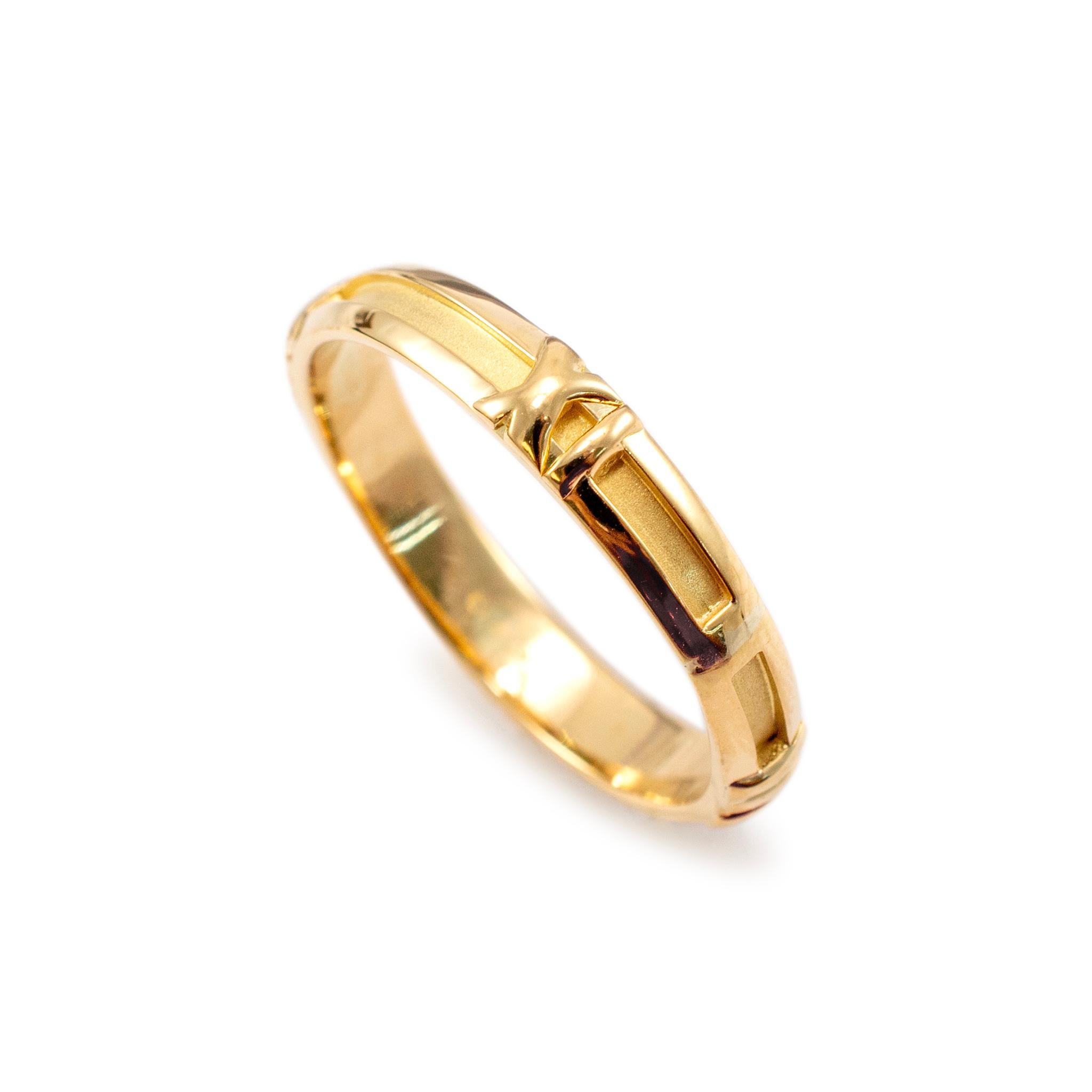 Brand: Tiffany & Co.

Gender: Men

Metal Type: 18K Yellow Gold

Ring Size: 12

Width: 4.20 mm

Weight: 4.70 grams

Men's 18K Yellow Gold wedding band with a comfort-fit shank. The metal was tested and determined to be 18K yellow gold. Engraved with