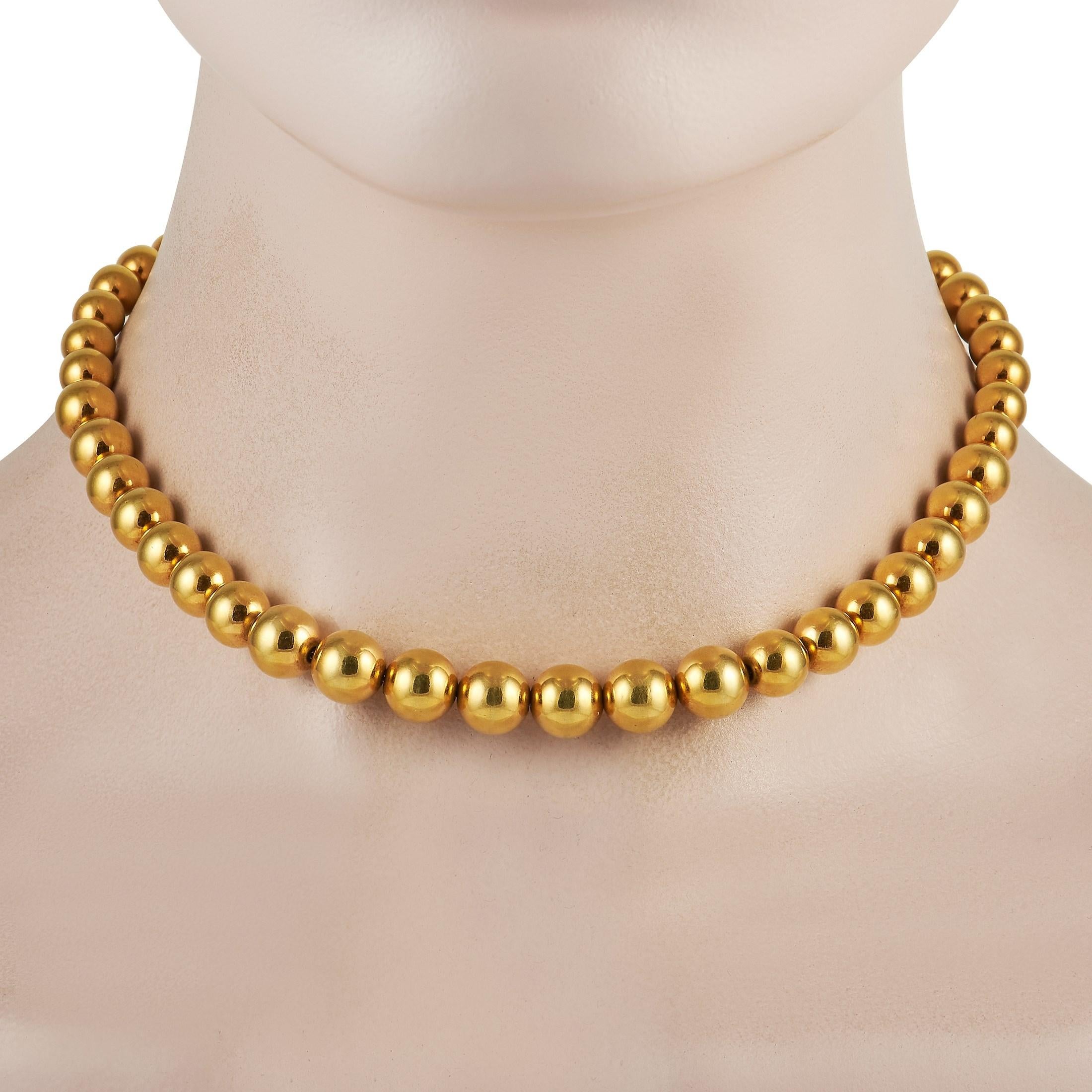 Glam up a pared-down outfit with the timeless elegance of this Tiffany & Co. Gold Bead Necklace. This accessory comes designed as a single strand of round golden beads. The simple yet stand-out style can instantly change the look of any outfit. Make
