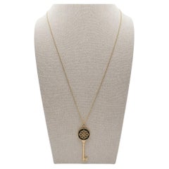 Tiffany & Co 18K Yellow Gold Black Enamel Knot Key Pendant