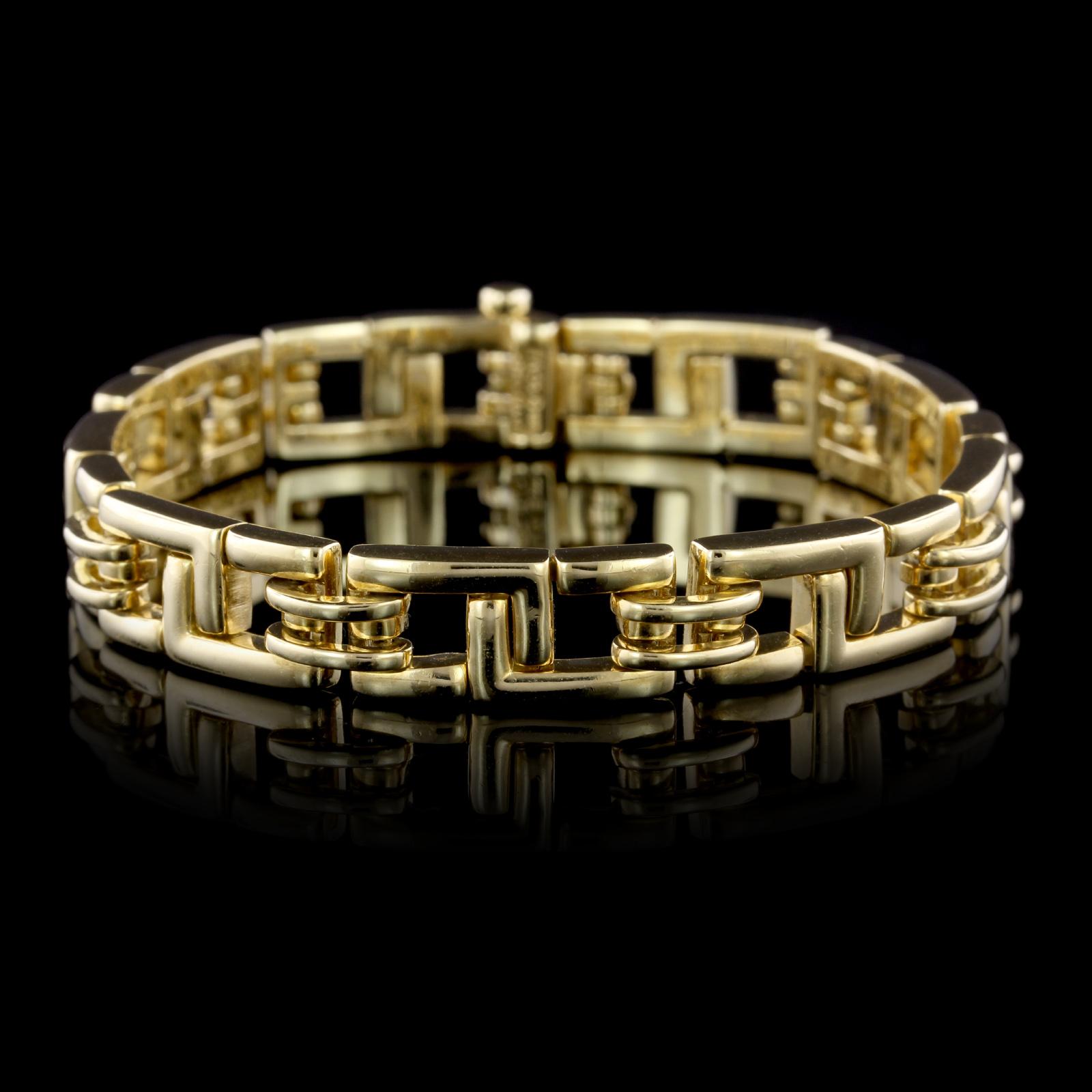 Tiffany & Co. 18K Yellow Gold Bracelet. The bracelet is designed with flexible fancy
links, circa 2001, length 7 1/2