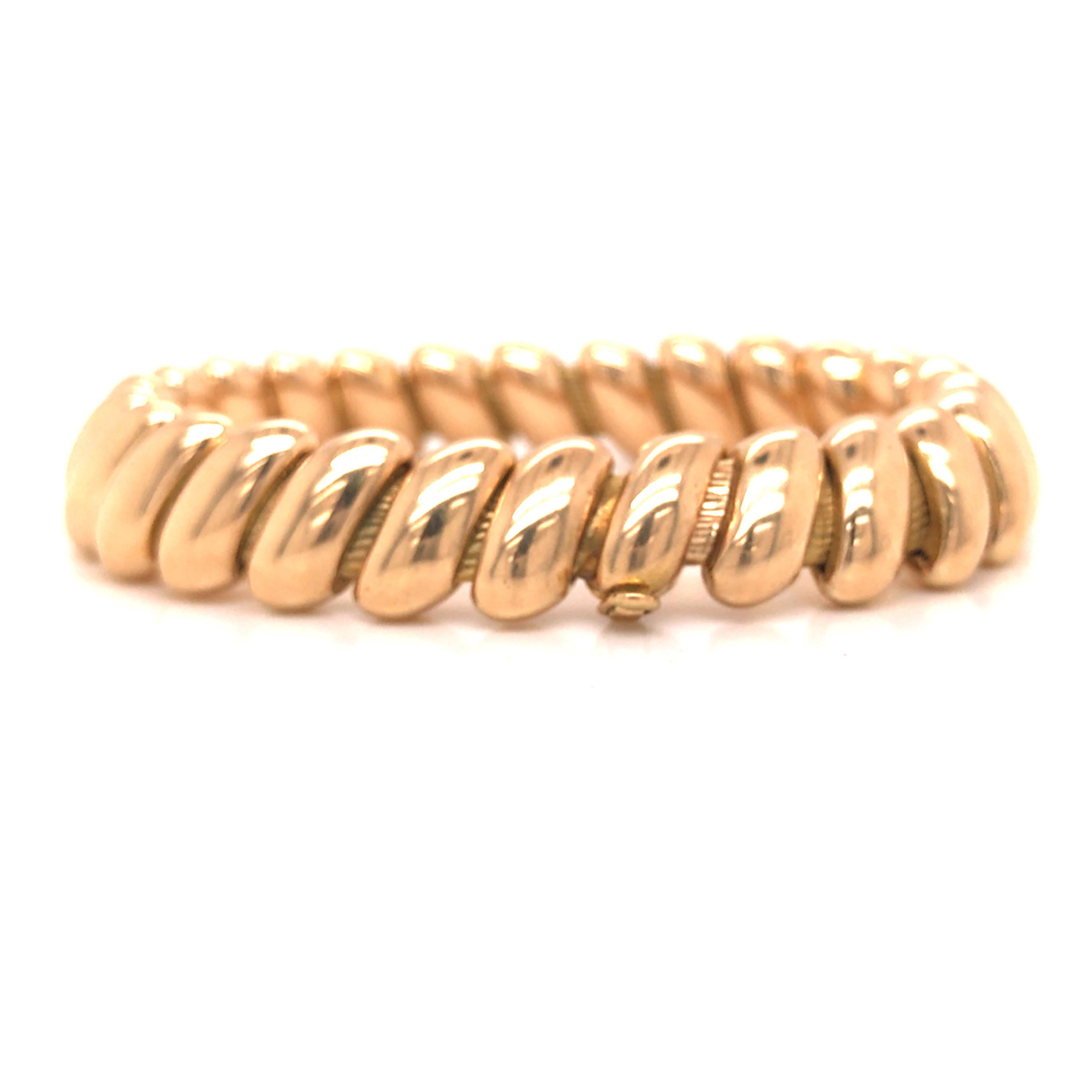Tiffany & Co. 18K Yellow Gold Bracelet.  The Bracelet measures 7 1/4 inch in length and 1/2 inch in width.  Stamped 