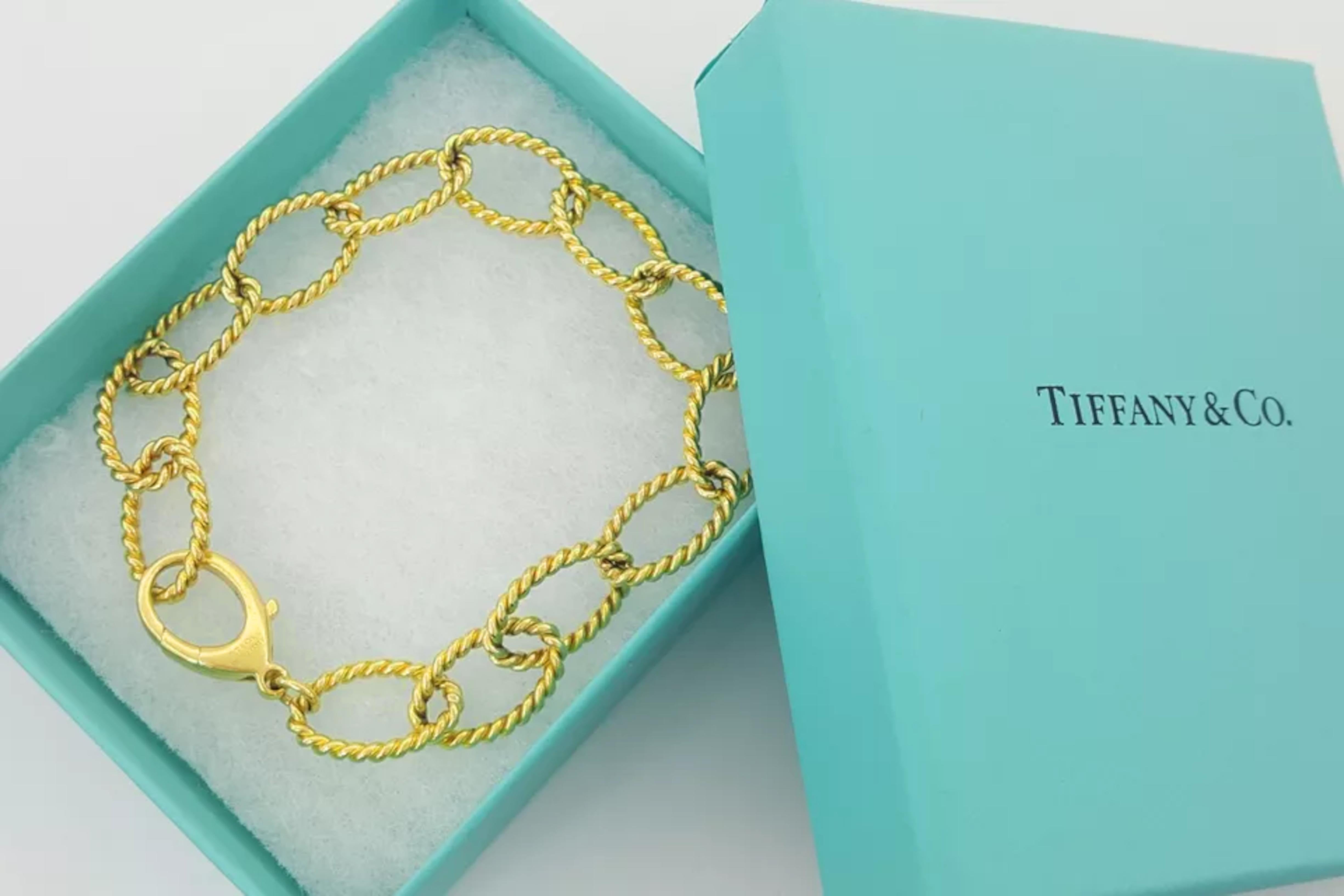 Contemporary Tiffany & Co. 18k Yellow Gold Braided Oval Link Bracelet. The bracelet weighs 28 For Sale