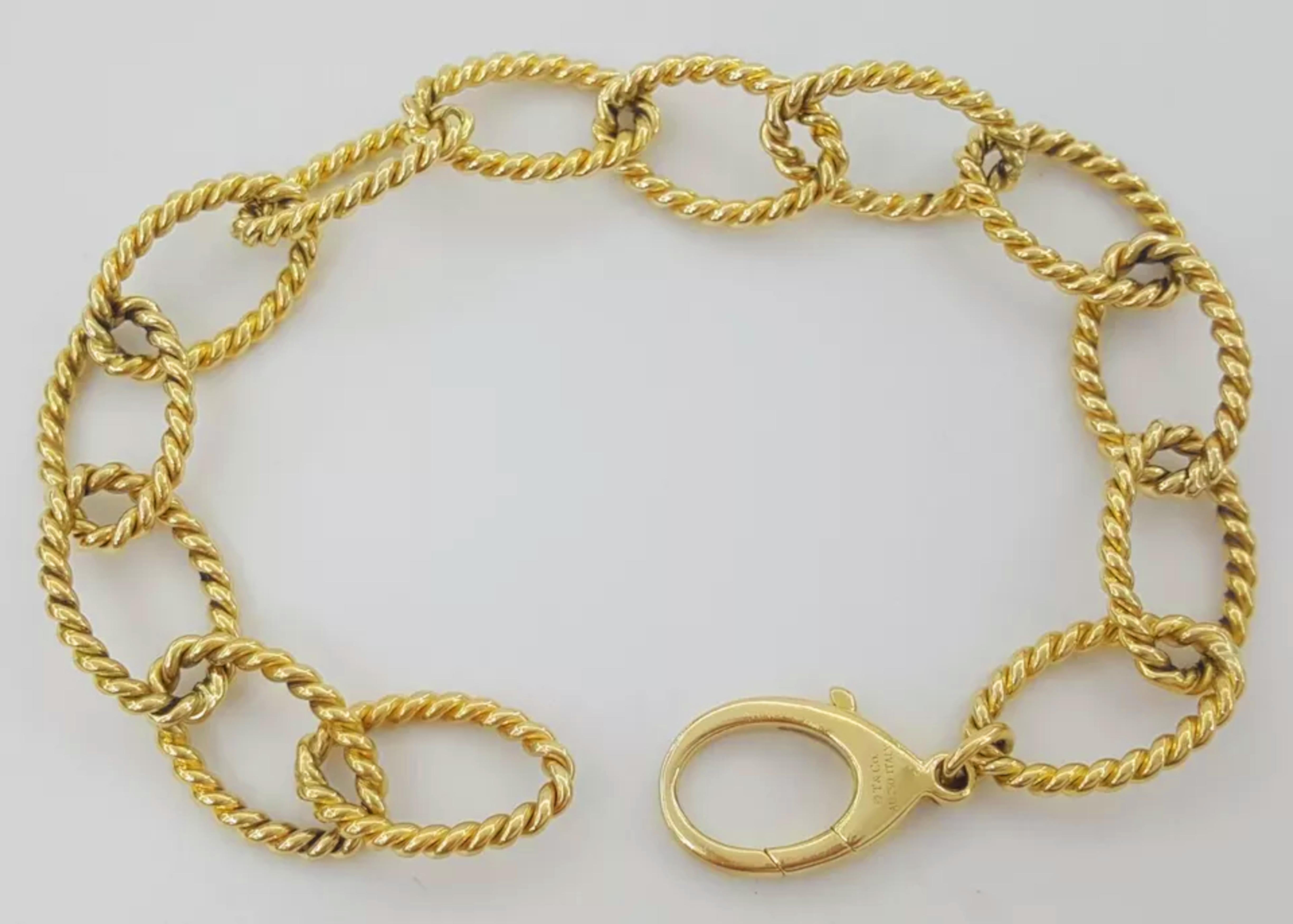 Tiffany & Co. 18k Yellow Gold Braided Oval Link Bracelet. The bracelet weighs 28 In Excellent Condition For Sale In Chicago, IL