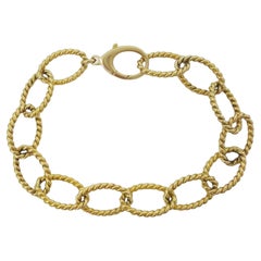 Tiffany & Co. 18k Yellow Gold Braided Oval Link Bracelet. The bracelet weighs 28