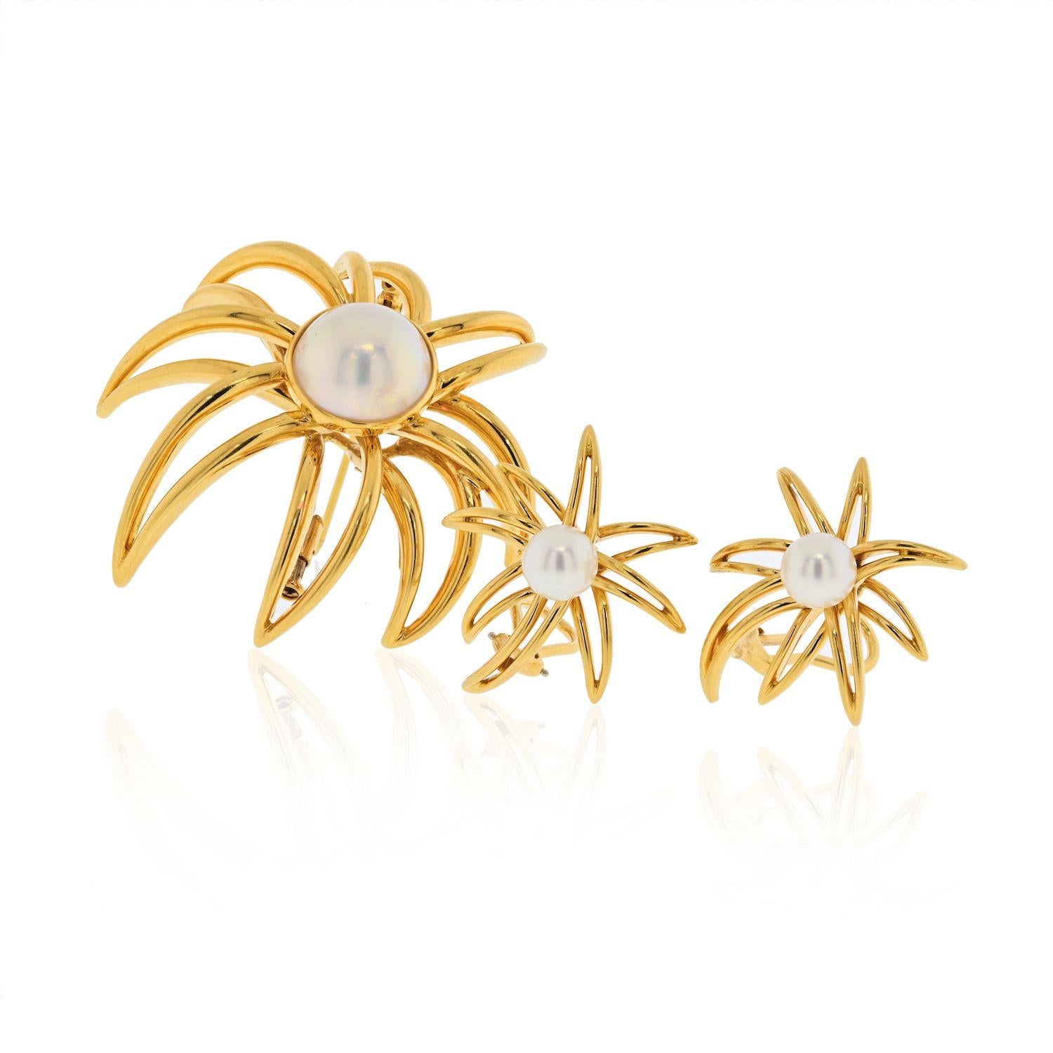 Gorgeous and authentic by Tiffany & Co. from the FIREWORKS collection. This fine pair of earrings are crafted from 18k yellow gold with a high polished finish with long pointed ends and a 7.3mm lustrous pearl mounted in the center of the