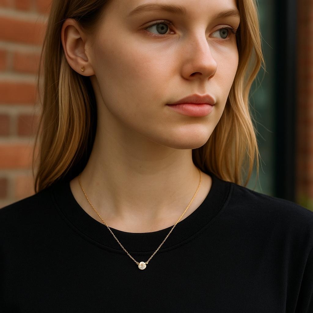 A Minimalist Icon of Timeless Elegance
Celebrate the understated sophistication of Tiffany & Co. with this “By the Yard” Diamond Necklace, featuring a single brilliant-cut diamond weighing approximately 0.14 carats. Set in a 3.75 mm bezel along an