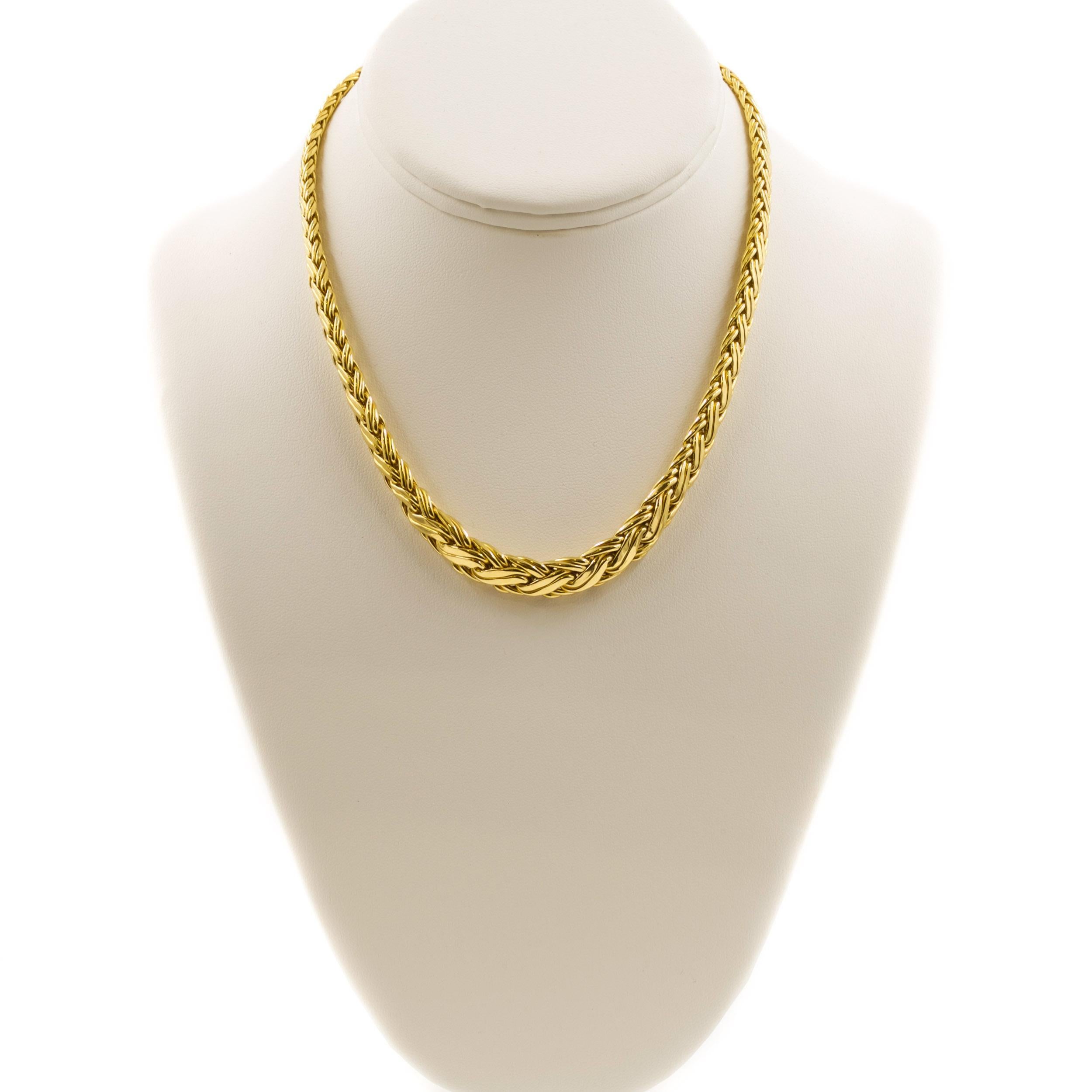 A lustrous and most striking Byzantine woven 18k yellow gold necklace by Tiffany & Co., this wonderful vintage design is complex with an overall graduation from the small diameter of the clasp to a full 3/8