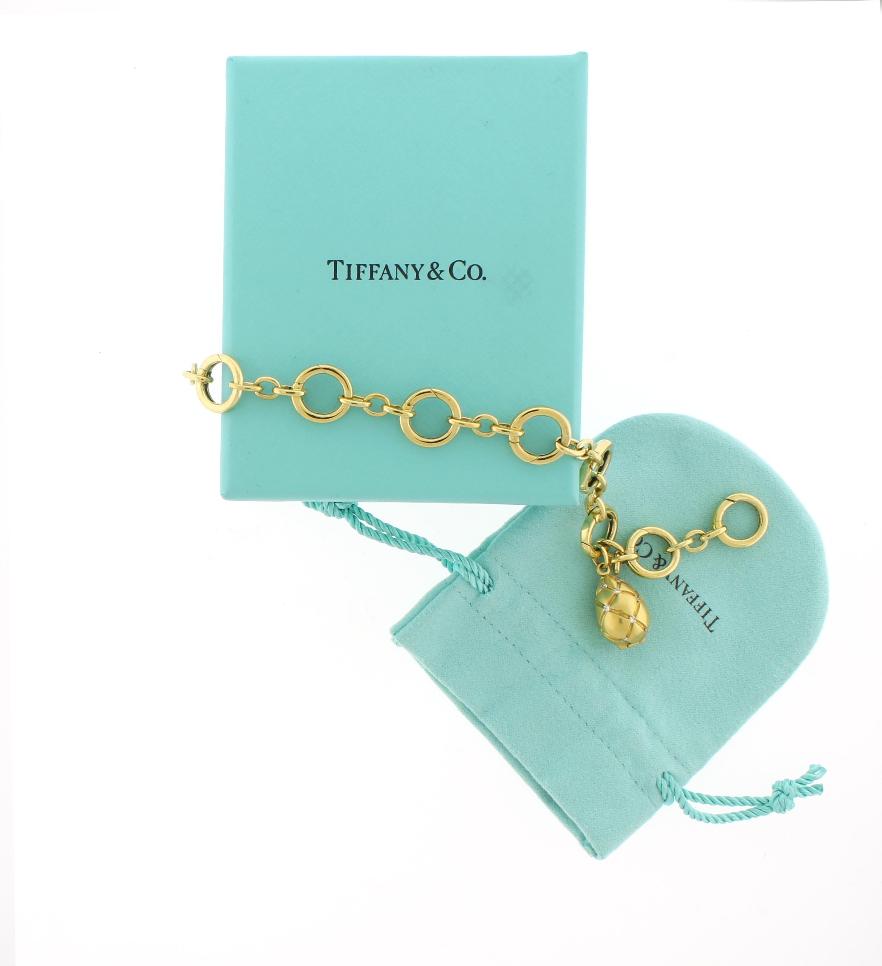 Tiffany & Co. 18k Yellow Gold Charm Bracelet with Diamond Egg Locket Excellent état - En vente à Bethesda, MD