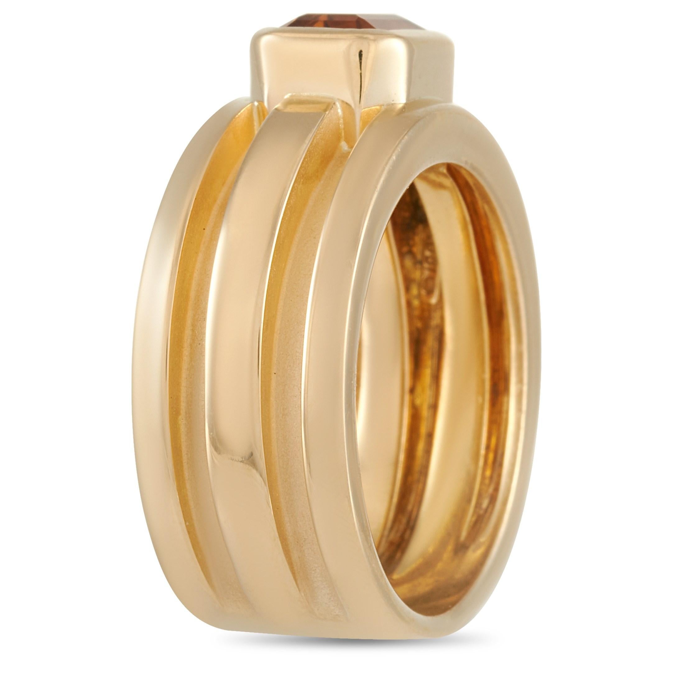 This Tiffany & Co. 18K Yellow Gold Citrine Ring is made with 18K yellow gold and features two large grooves around the band. The ring is set with a pretty radiant cut Citrine in the face.  The ring has a band thickness of 8 mm, a top height of 5 mm,
