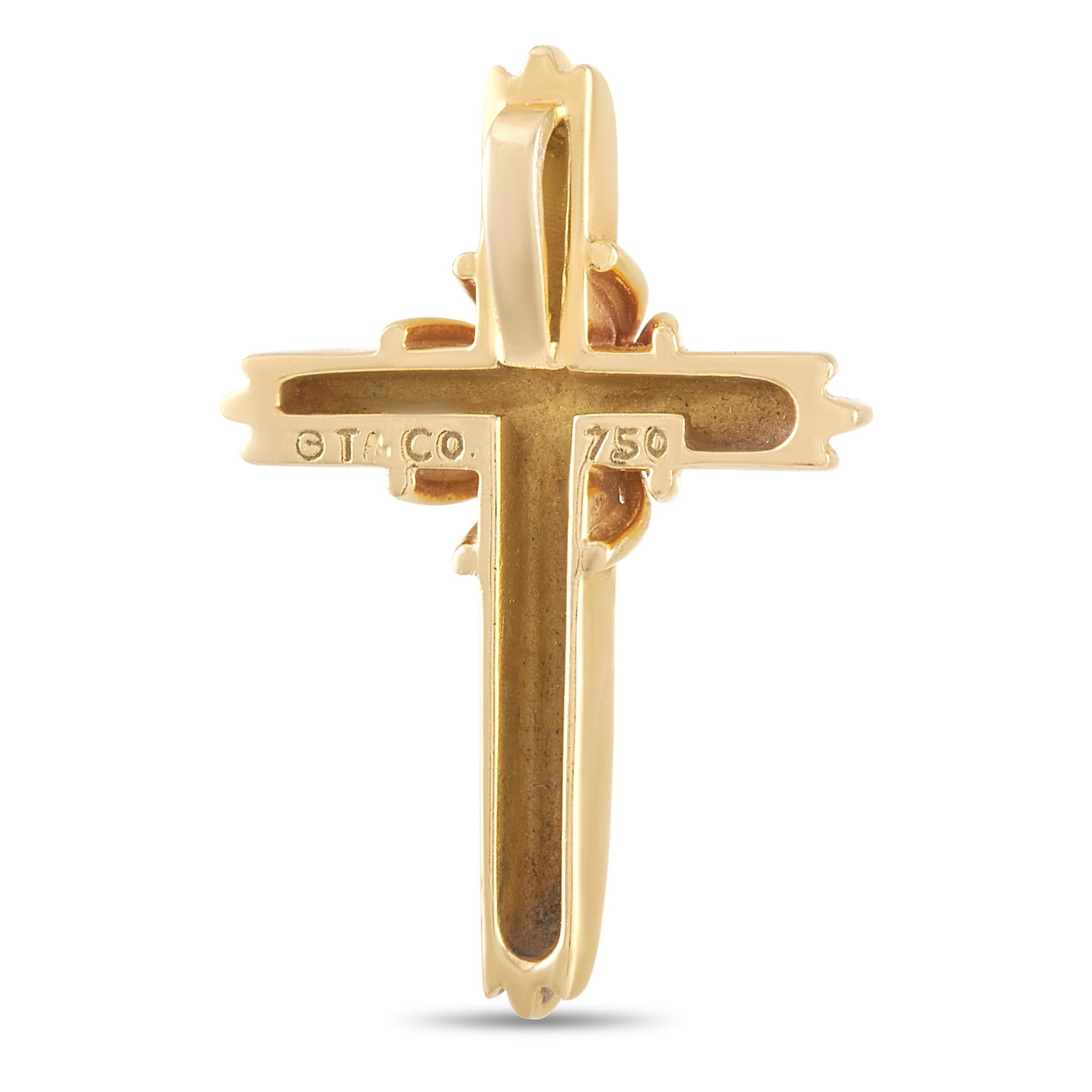 This pretty Tiffany & Co.18K Yellow Gold Cross Pendant is made with 18K yellow gold and measures 1 inch in length by 0.75 inches in width. The pendant weighs a total of 4.4 grams. 
 
 This pendant is presented in estate condition and includes a gift