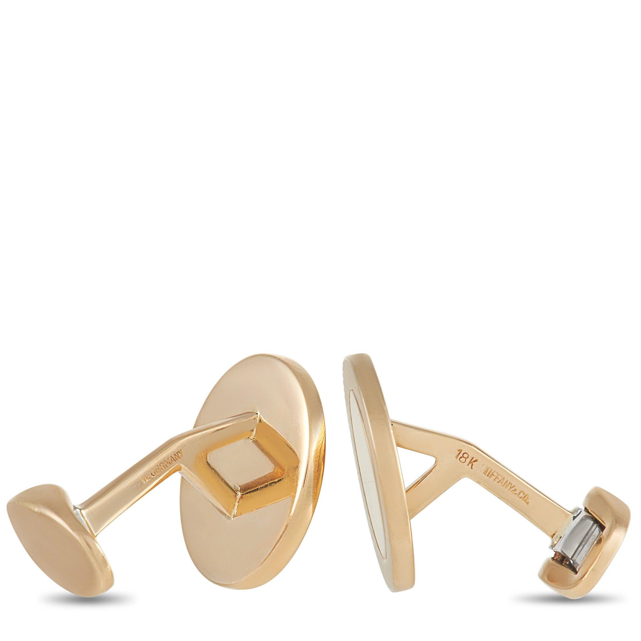 These sleek Tiffany & Co. 18K Yellow Gold Cufflinks are sure to impress. The cufflinks are made with 18K yellow gold, with a subtle texture around the edges. The cufflinks measure 0.75 inches around, with each weighing 11.2 grams for a total weight