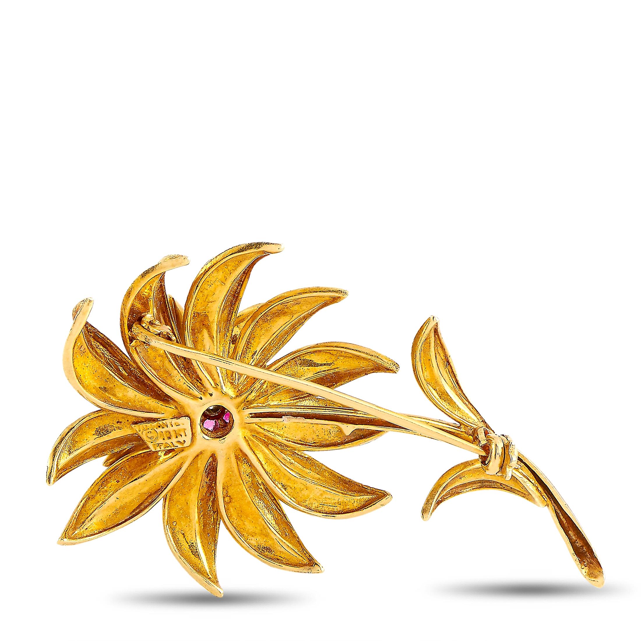 This Tiffany & Co. flower brooch is made of 18K yellow gold and embellished with rubies and a diamond. The brooch weighs 15.4 grams and measures 2.25” in length and 1.37” in width.
 
 Offered in estate condition, this item includes the