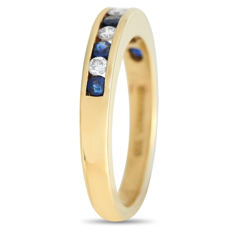 An alternating series of round-cut Diamonds and Sapphires add elegance to this Tiffany & Co. ring. The minimalist 18K Yellow Gold setting features a 2mm wide band and a top height measuring 3mm.


This jewelry piece is offered in estate condition