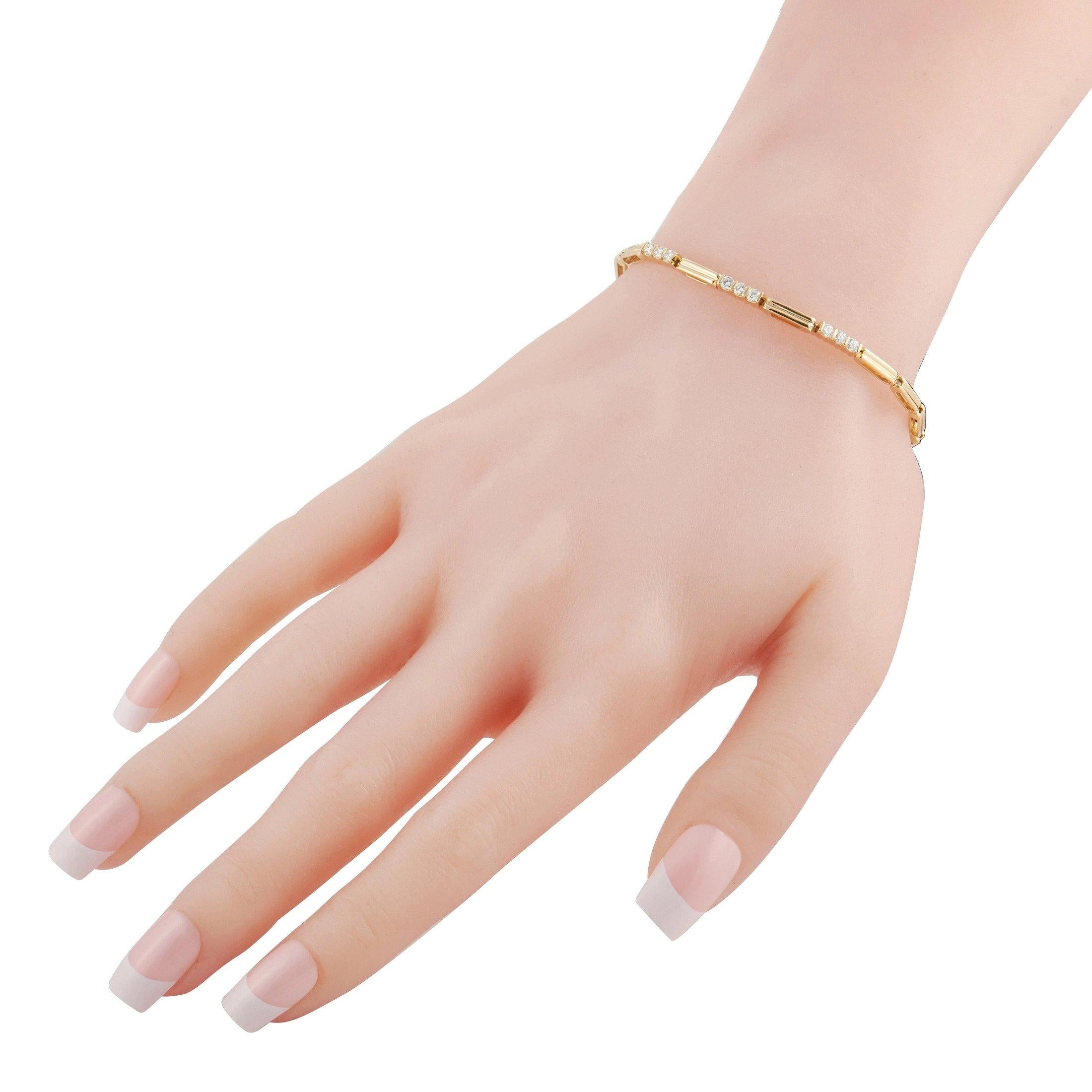 Sleek and simple in design, this 18K Yellow Gold bracelet from Tiffany & Co. allows you to effortlessly add a touch of luxury to your everyday wardrobe. Although this 7” wide piece possesses an inherently low profile, it’s accented by glittering