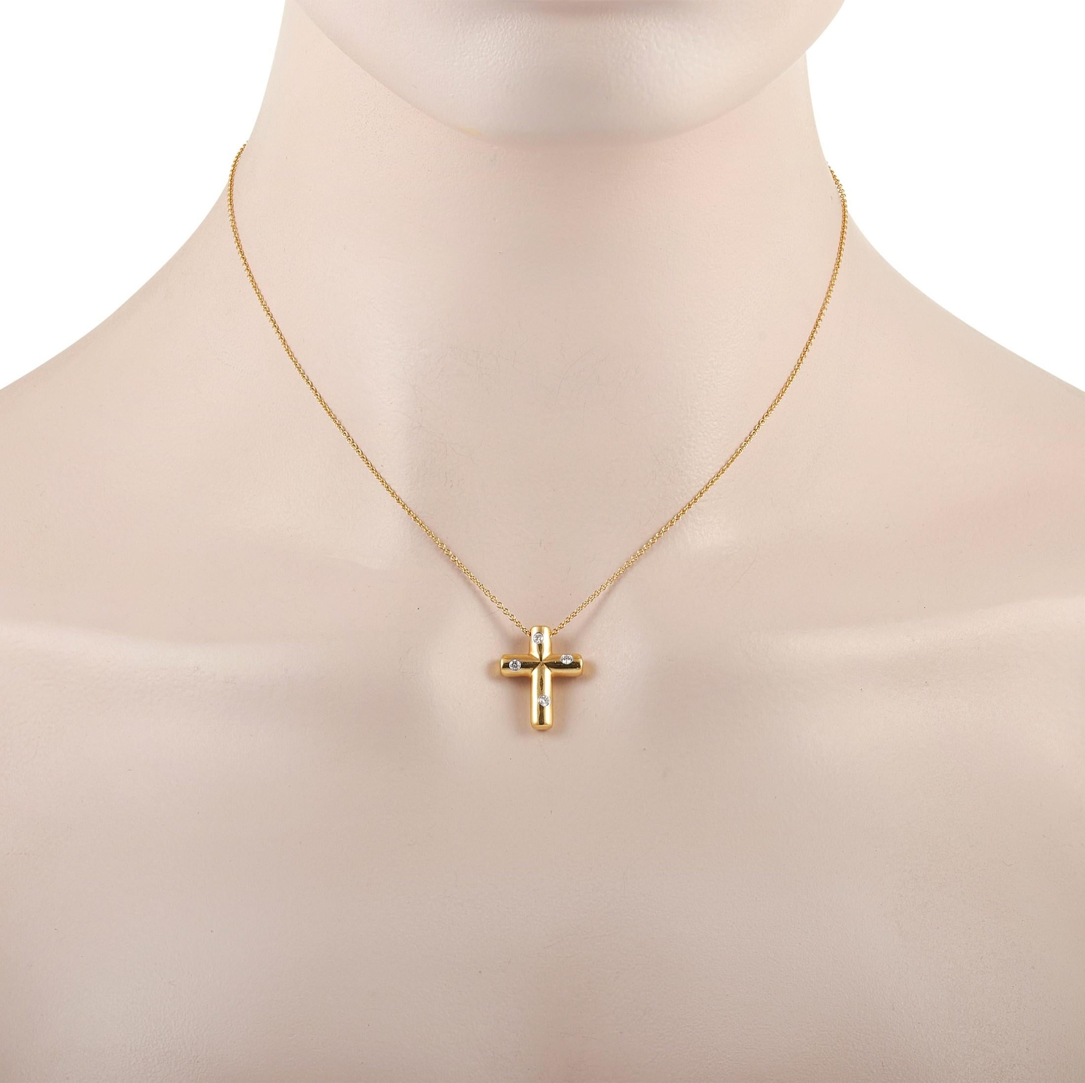 This Tiffany & Co. 18K Yellow Gold Diamond Cross Pendant Necklace is made with 18K Yellow Gold and features a delicate chain that measures 15 inches in length. The 18K Yellow Gold Cross Pendant measures 0.75 inches in length and 0.57 inches in width