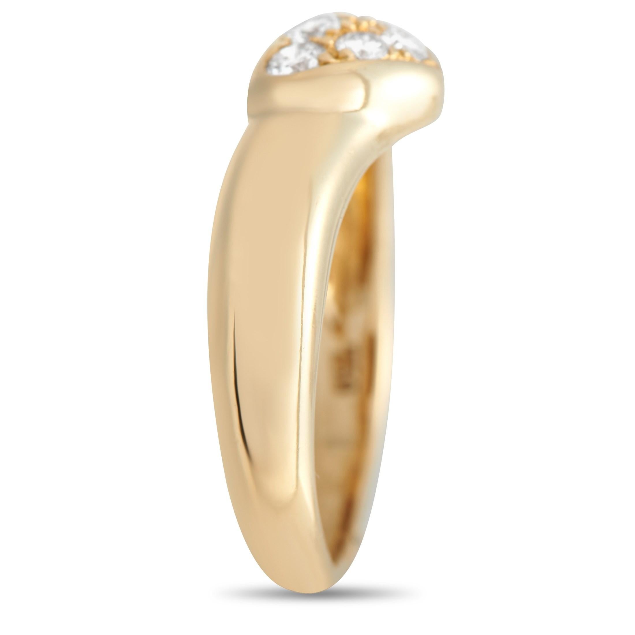 Sweet and stylish, this Tiffany & Co. ring is an enchanting way to elevate any ensemble. A heart-shaped motif at the center is accented by sparkling inset diamonds, which contrast beautifully against the lustrous 18K Yellow Gold setting. This piece