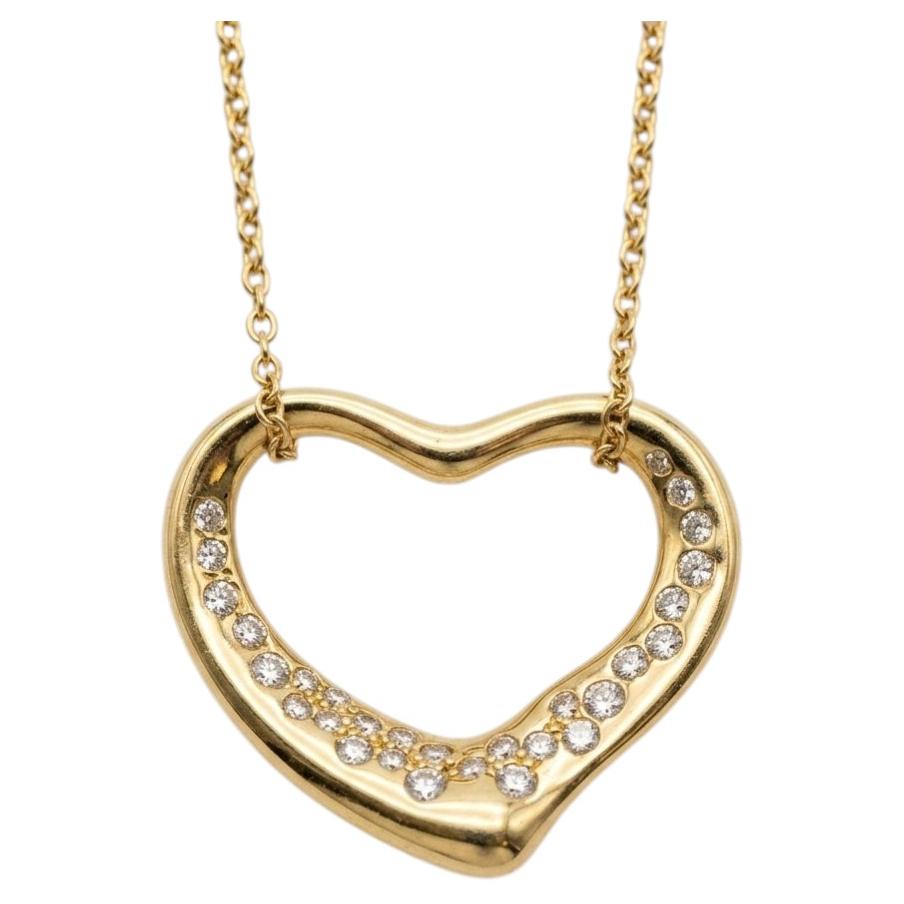 Collier Tiffany & Co. avec pendentif en forme de cœur ouvert en or jaune 18 carats serti de diamants