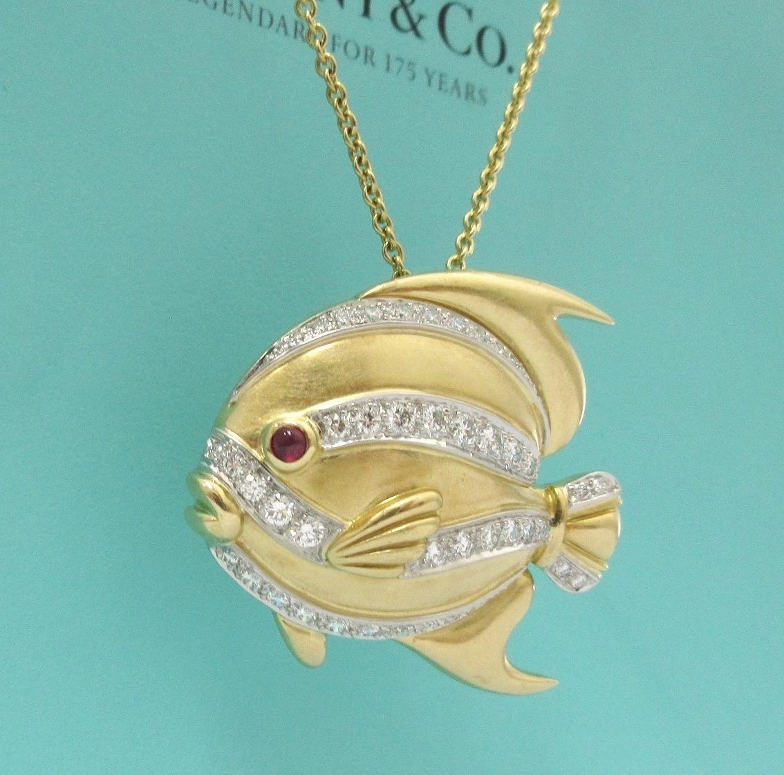 TIFFANY & Co. 18K Yellow Gold Diamond Ruby Fish Pendant Necklace Large

Metal: 18K yellow gold 
Weight: 22.80 grams 
Pendant: 36mm (1.42