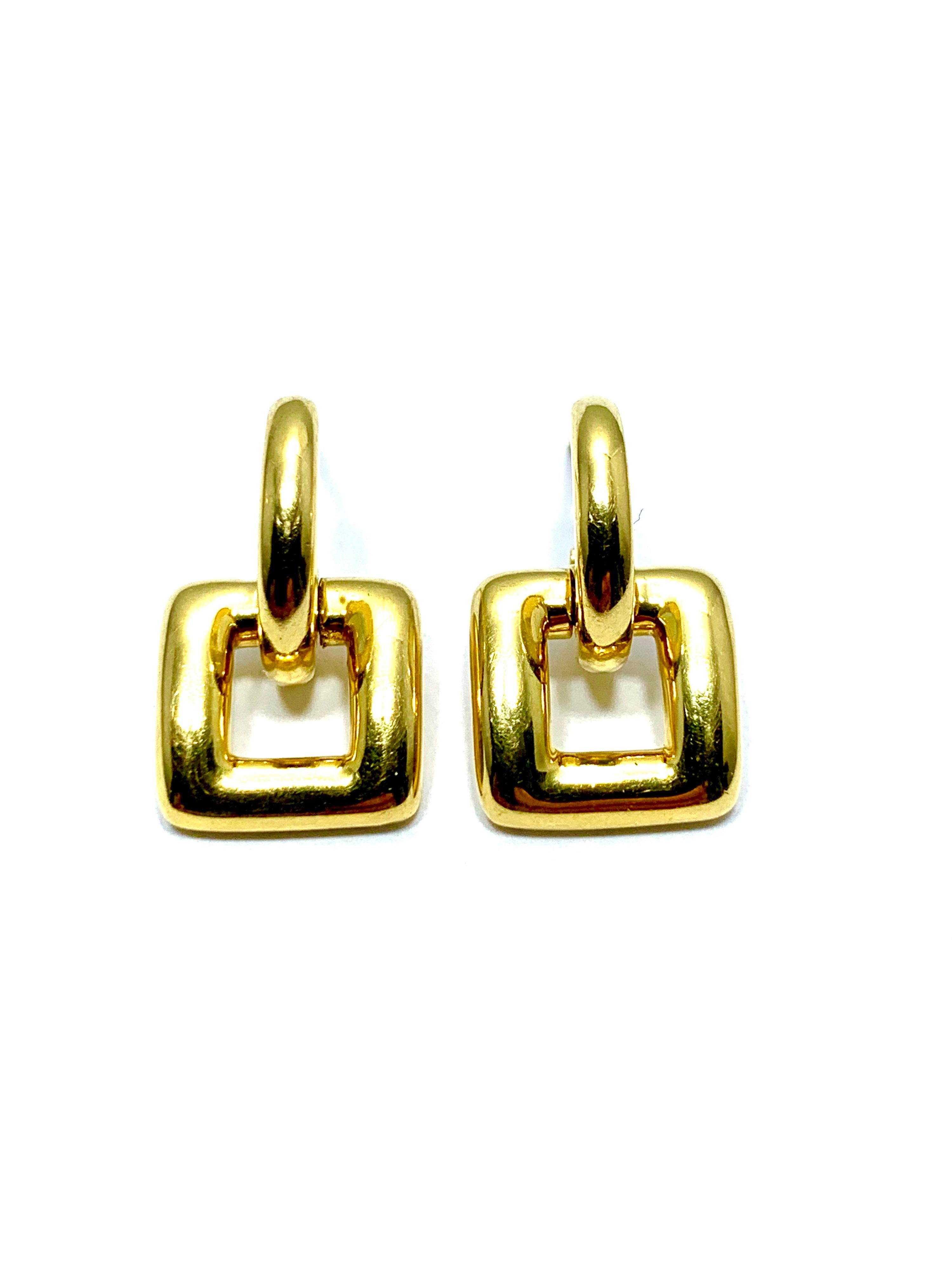 Simple and easy to wear, these Tiffany & Co. door knocker earrings will be a great addition to any wardrobe.  They are made in 18 karat yellow gold, and sit in the ear on a post.  The bottom portion of the earring is hinged to allow for movement. 