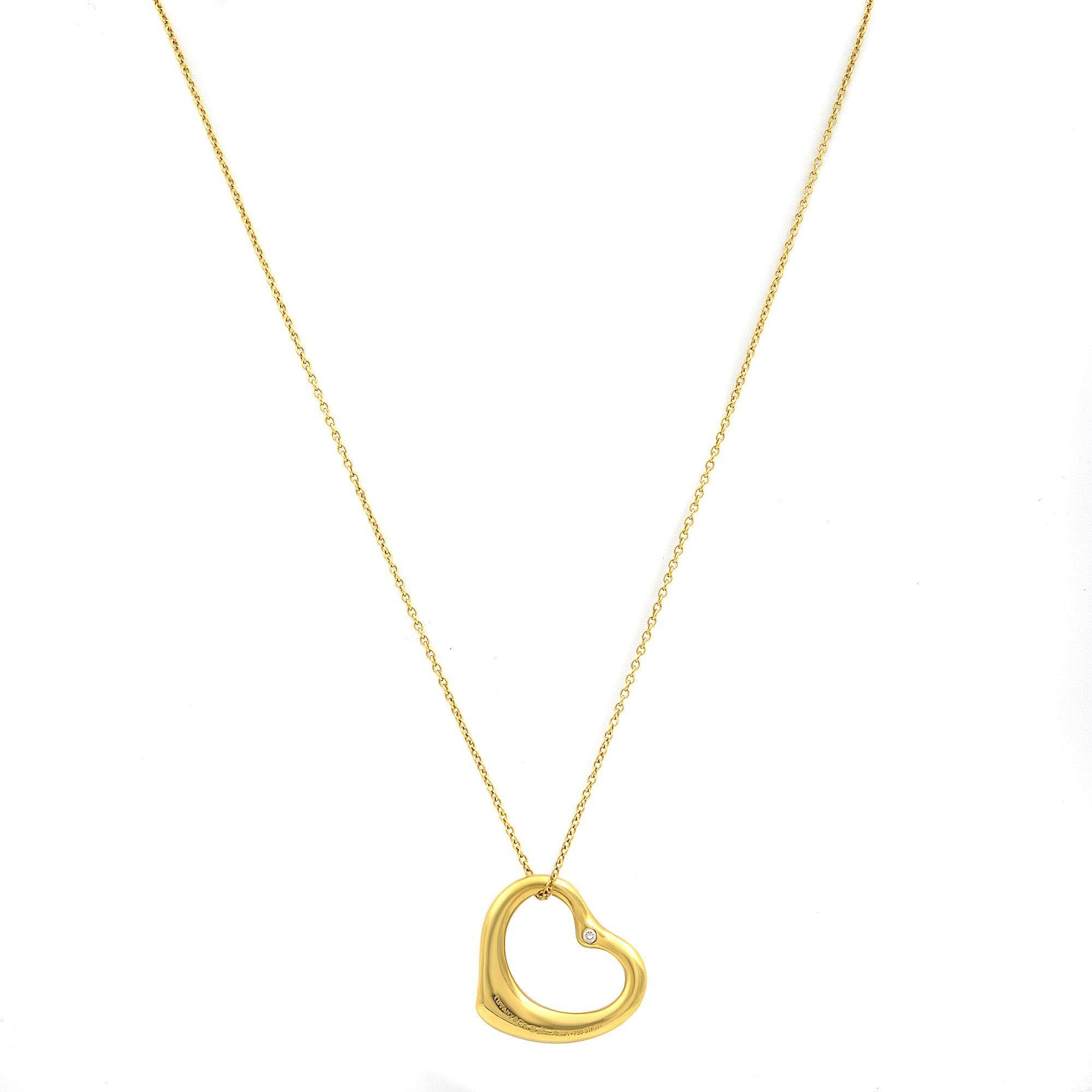 Modern Tiffany & Co 18 Karat Gold Elsa Peretti Open Heart Pendant Necklace 0.04 Carat